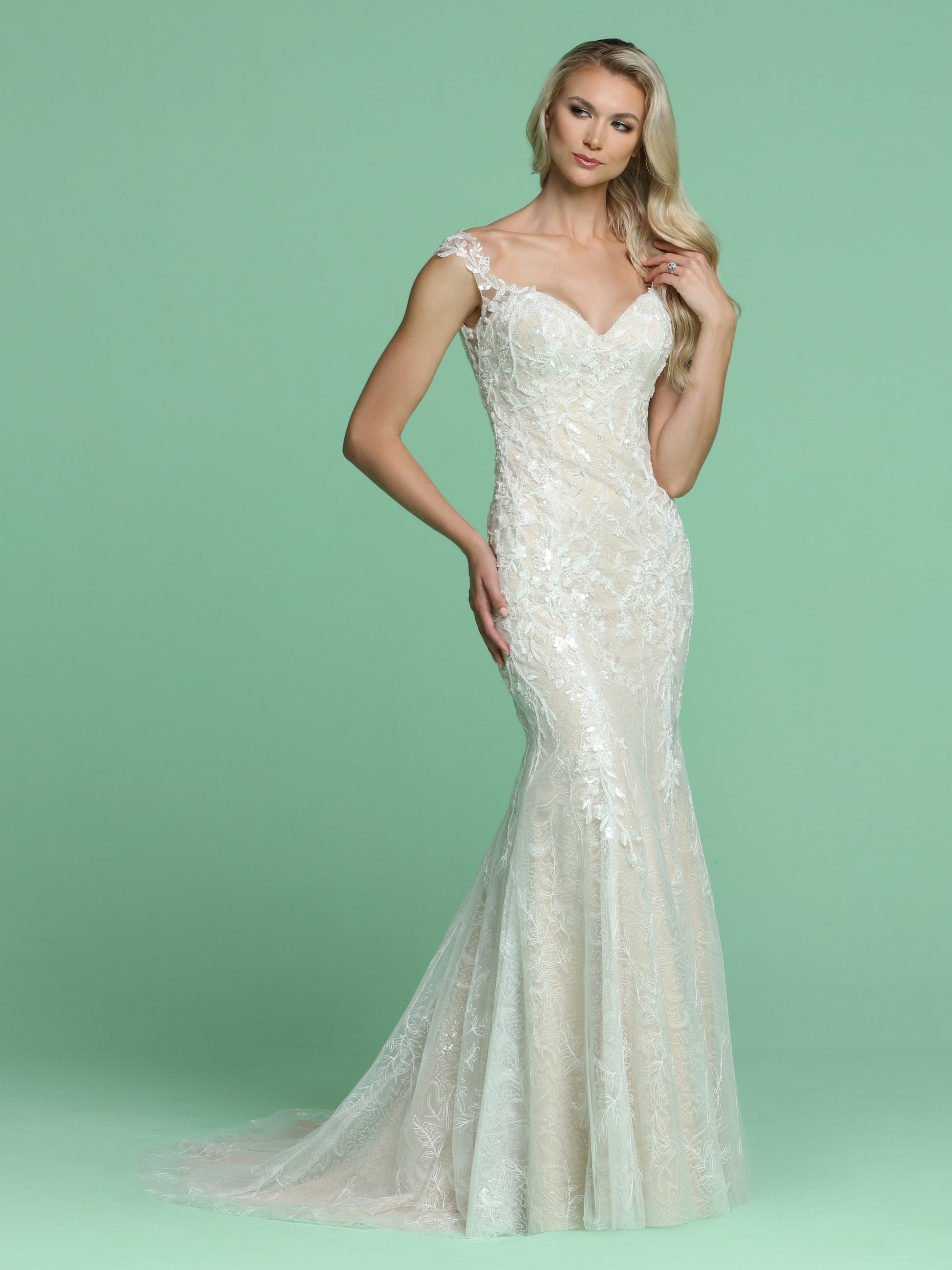 Davinci Bridal 50602 is a long Lace over Lace Floral applique Mermaid silhouette wedding Dress. This Bridal Gown Features a deep sweetheart neckline with off the shoulder sheer lace cap sleeves wrapping around to a sheer lace applique upper V back with buttons. Petite Sequins embellish this detailed lace. Sweeping lace Train!  Available for 1-2 Week Delivery!!!  Available Sizes: 2,4,6,8,10,12,14,16,18,20  Available Colors: Ivory/Ivory, Ivory/Nude