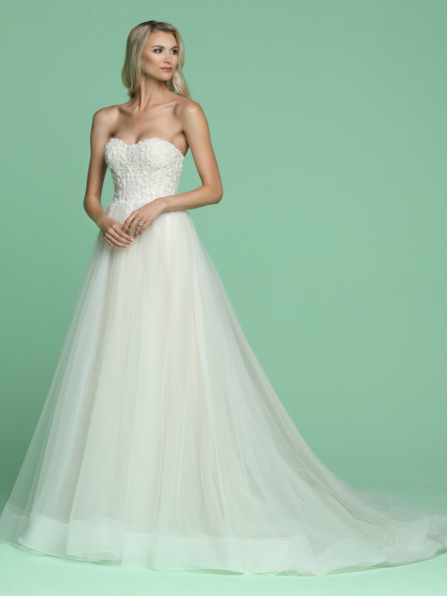 Davinci Bridal 50614 is a long Soft Tulle A Line ballgown with a strapless floral beaded applique bodice. Horse hair trim on the layers of lush tulle the skirt leading into a sweeping train.   Available for 1-2 Week Delivery!!!  Available Sizes: 2,4,6,8,10,12,14,16,18,20  Available Colors: Ivory/Ivory, Ivory/Nude