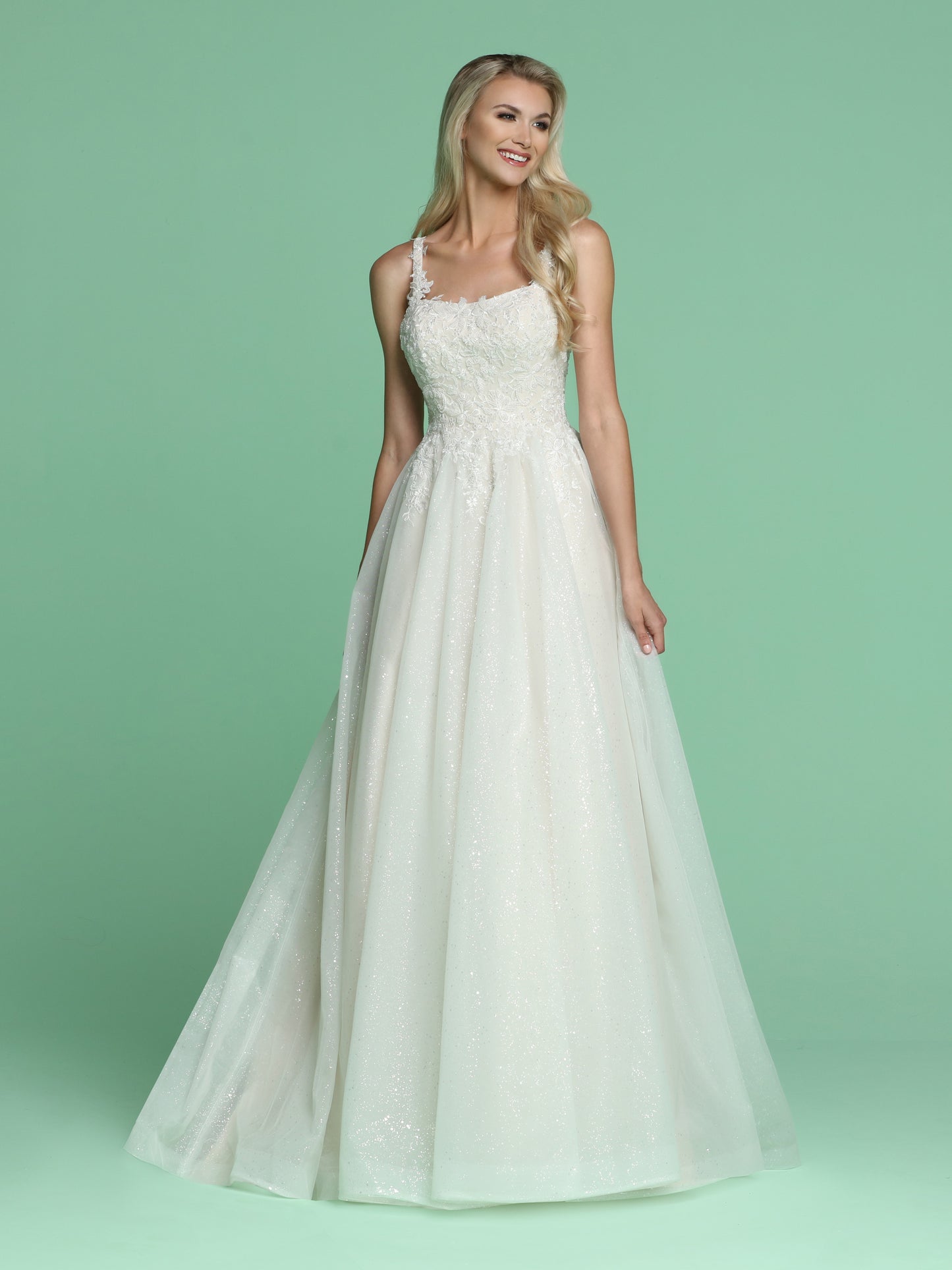 Davinci Bridal 50628 is a Beautiful Long Shimmering wedding dress. Featuring a Fitted bodice with embroidered lace cascading into a stunning Glitter shimmer tulle A line ball gown skirt with pockets and a lush train. Straps with embroidered lace cascading over. Available for 1-2 Week Delivery!!!  Available Sizes: 2,4,6,8,10,12,14,16,18,20  Available Colors: Ivory/Blush, Ivory/Ivory