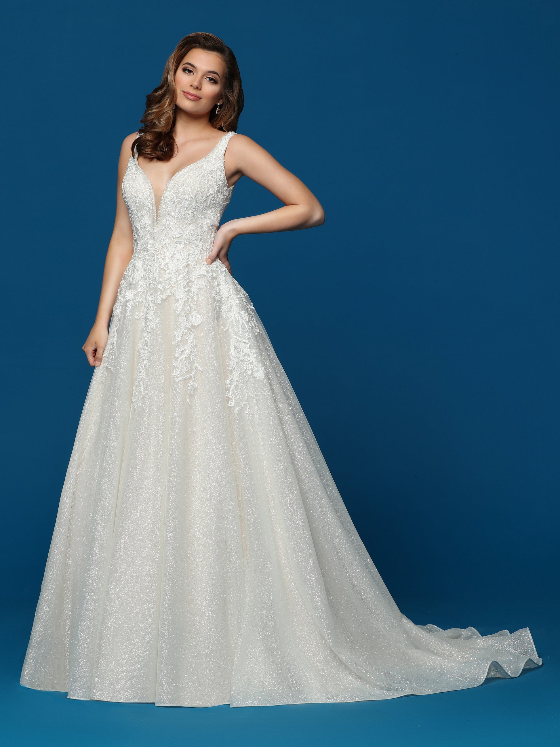Davinci Bridal 50655 This is a sparkly lace and glittered tulle A line long wedding dress.  This bridal gown has a lace v neckline and a v back with a train.  Colors:  Ivory/Blush, Ivory/Ivory  Sizes  2-20
