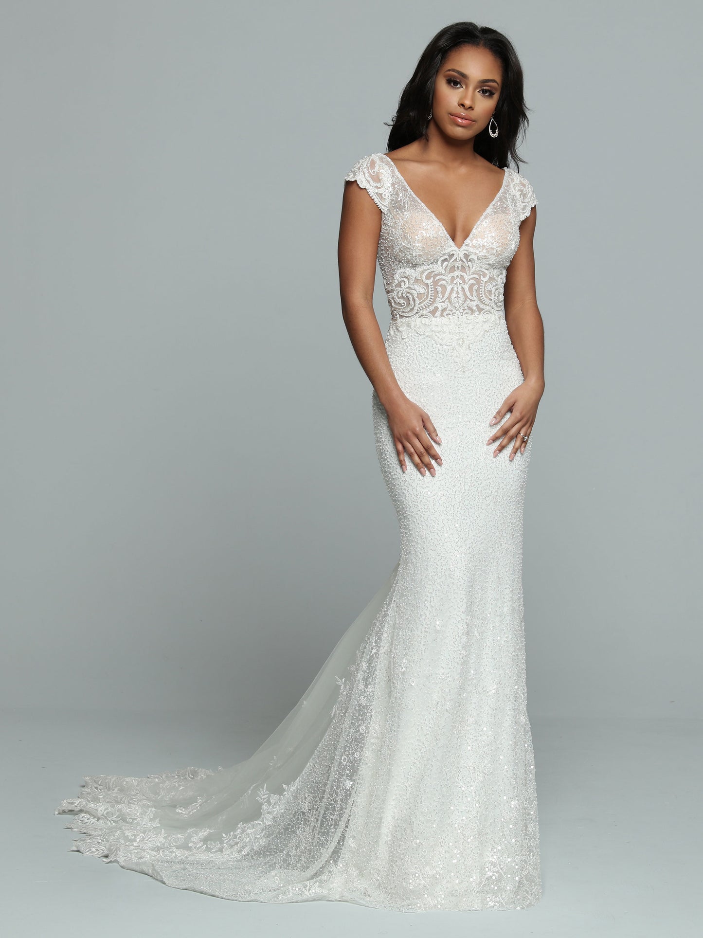Davinci Bridal 50666 Long Sheer Sequin Mermaid Wedding Dress Lace Train Gown Sparkling Sequin Fit & Flare Sheath Wedding Dress features a Sheer Bodice with V-Neckline & Deep V-Back. Beaded Lace Applique covers the Bodice & Wide Off the Shoulder Straps. The Skirt has a Sheer Back Panel that ass Fullness to the Lace Edged Sheer Chapel Train.