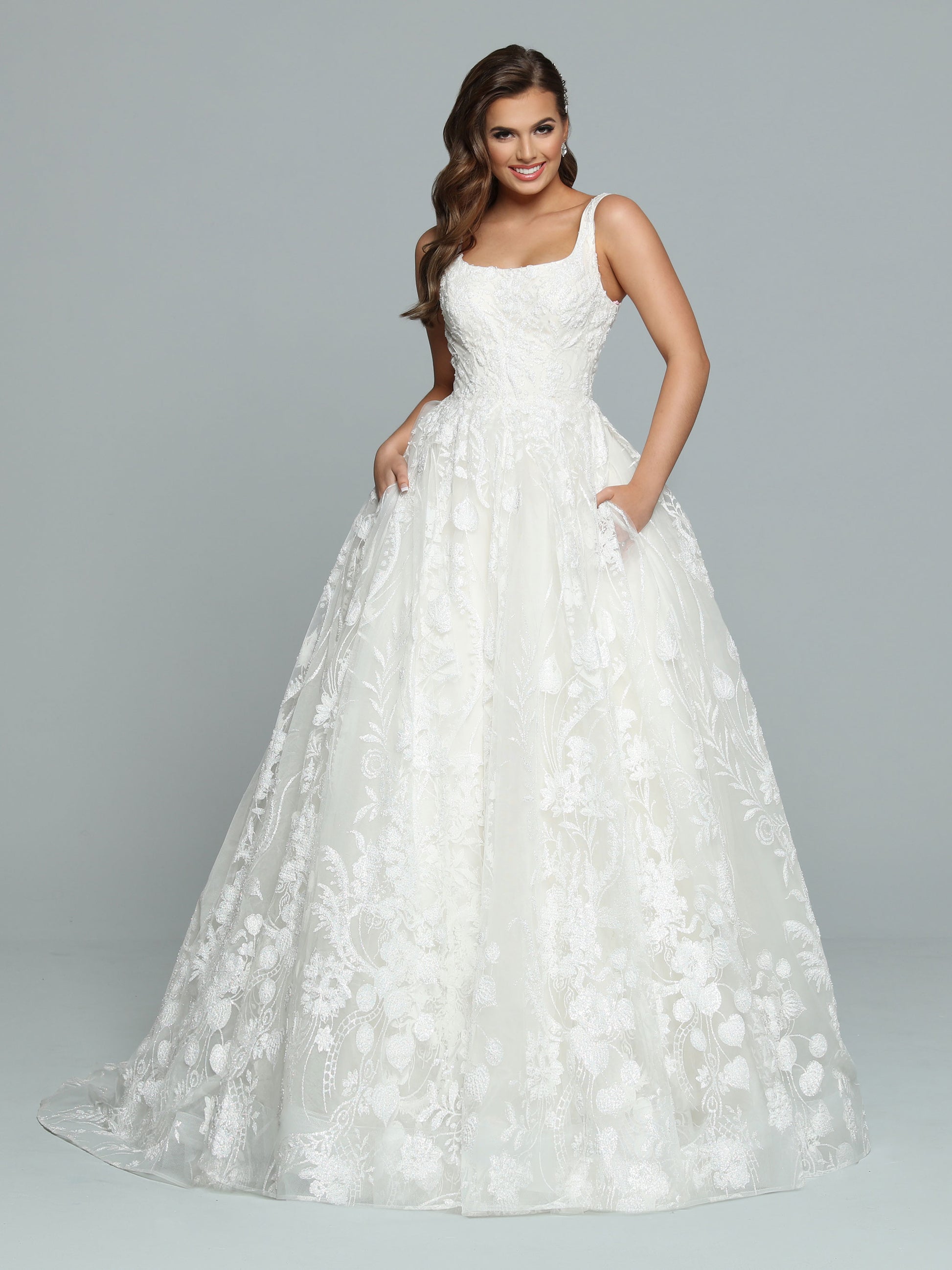 Davinci Bridal 50669 is a Gorgeous Shimmering A Line Ball gown with pockets! scoop neckline with wide straps. Pearlette accented shimmer lace. This wedding dress is an amazing bridal style!  Available Size: 12  Available Color: Ivory/Ivory