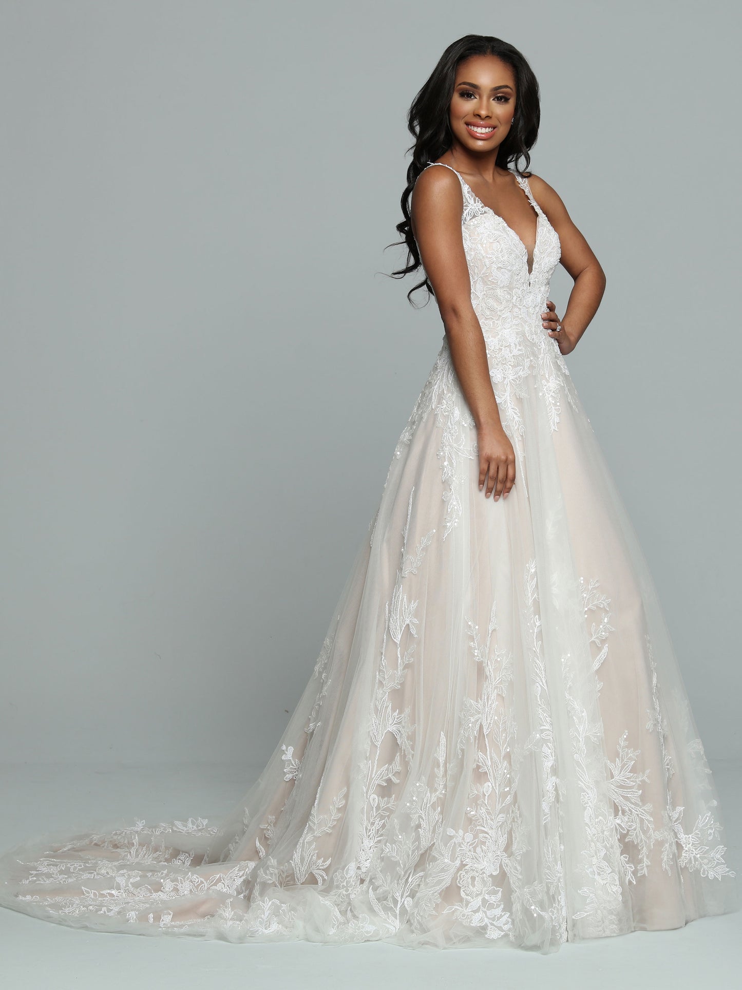 Davinci Bridal 50672 A line Lace Ballgown Wedding Dress Sheer Back Bridal Gown Beautiful Tulle A-Line Wedding Dress with a Ball Gown Vibe features a Deep V-Neckline with Sheer Modesty Panel. Lightly Beaded Lace Applique Covers the Bodice & frames the Sheer Back. More Lace Applique highlights the Full Skirt & Chapel Length Train. Sparkling Sequin Accents & Covered Buttons finish the look.