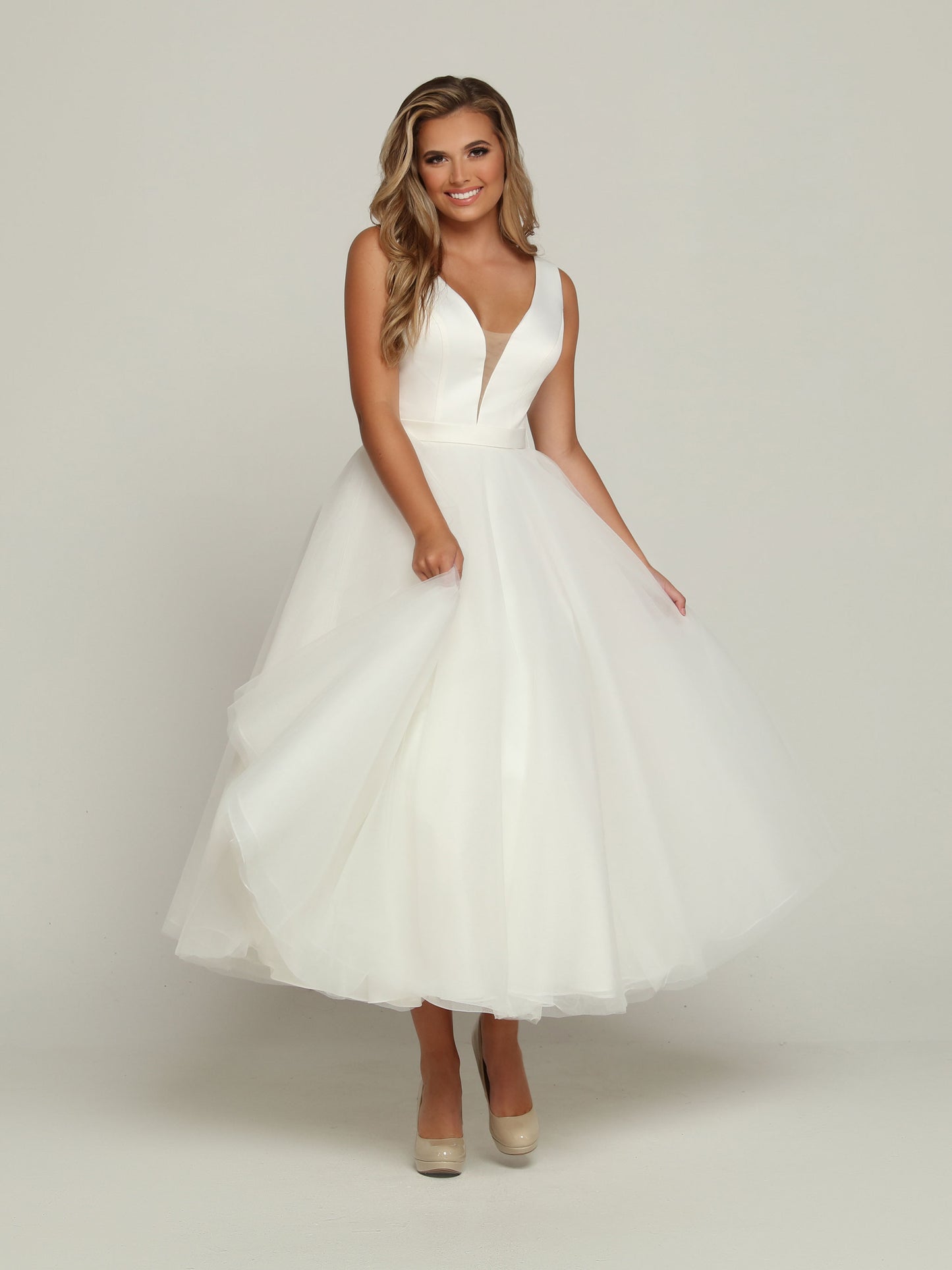Davinci Bridal 50685 Tea length Ballgown removable skirt wedding dress Bridal Gown Tulle Two Looks in one, this Two-Piece Satin & Tulle A-Line Ball Gown Wedding Dress starts with a Plunging V-Neckline & Sheer Side Panels. The Scoop Back has a Sheer Overlay with a Covered Button Trim. Remove the Top Skirt with its Chapel Train to reveal a Pretty Tea Length Dress.