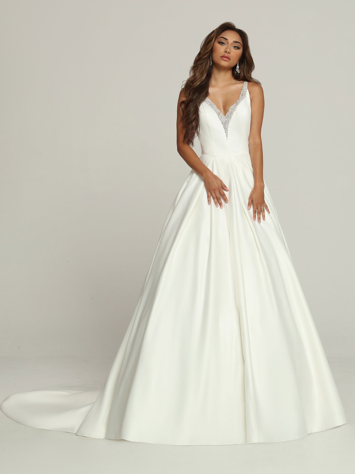 Davinci Bridal 50690 Satin A Line Ballgown Wedding Dress Sheer Rhinestone V Neck Bridal Gown Modern Details make this Satin A-Line Ball Gown Wedding Dress a Classic. The Tailored Bodice features a Plunging V-Neckline & Low Scoop Back. Beaded Applique Accents the Neckline, Straps & Sheer Back with its Covered Button Accents. The Generous Inverted Pleat Skirt has a Chapel Train.