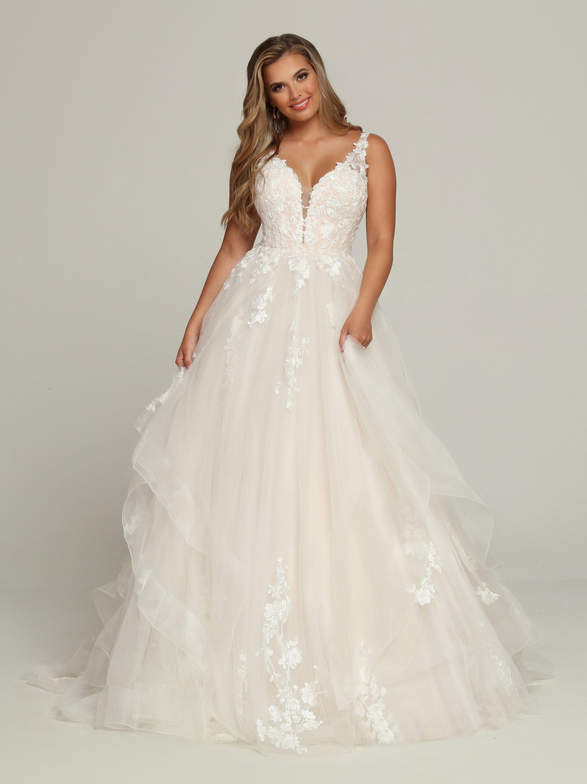 Davinci Bridal 50695 A Line Ruffle Layer Ballgown Wedding Dress Lace V Neck Bridal Gown Straight out of a Fairytale, this Lace & Tulle A-Line Ball Gown Wedding Dress features a Plunging Sweetheart V-Neckline with Modesty Panel & Low V-Back. Lace Covers the Bodice Front & Highlights the Straps & Sheer Back. The Full Tulle Skirt with Chapel Train has Tiered Layers with Lace Medallion Accents. Covered Buttons Hide the Zipper Closure.