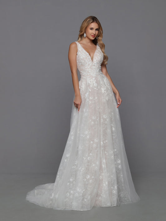 The focal point of this tulle and lace A-Line wedding dress is the open back. Criss-cross beaded straps highlight the shoulder blades and lead the eye to the softly flowing, gathered tulle skirt and chapel train. Davinci Bridal 50760 Beaded Sequin Lace A Line Wedding Dress V Neck Bridal Gown 