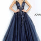 Jovani 55634 v neckline lace floral applique and tulle prom dress ball gown. Tulle ballgown, floor length, floral appliques, sheer sleeveless bodice, bra cups, v neckline and back. Available Colors: black/black, fuchsia, champagne, navy/black, off white/blush, off white/light blue, off white/off white, off white/yellow, off white/ lilac, red, teal  Available Sizes: 00 - 24