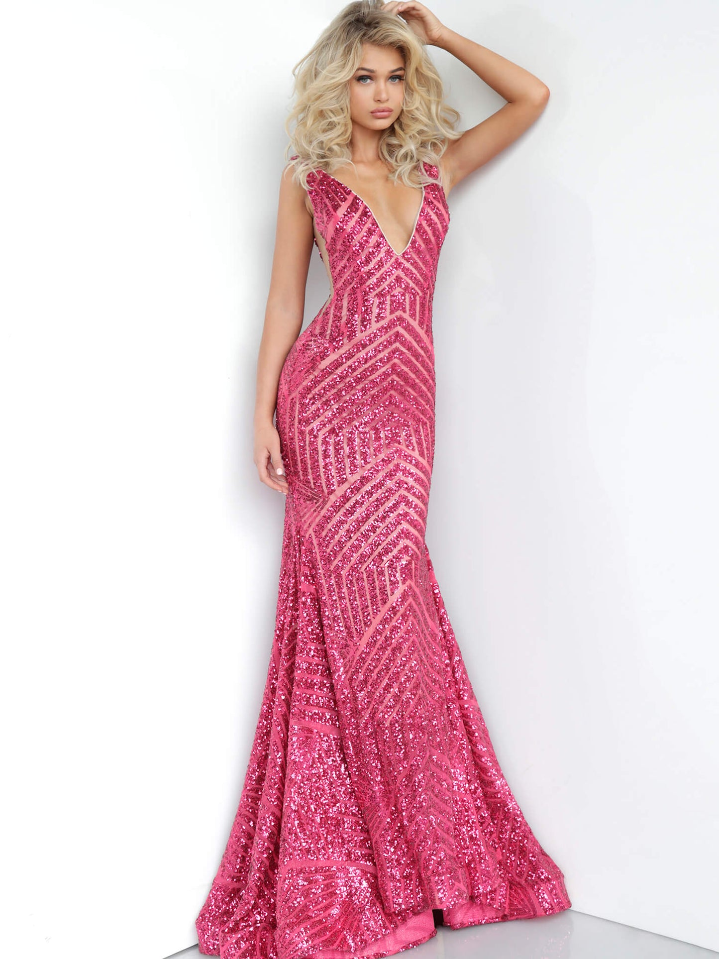 Jovani 59762 Deep V neckline Sequin Embellished mermaid Pageant Prom Dress, Deep V Neckline with sheer mesh side cutout panels. lush trumpet skirt with sweeping train  Available Color: Fuchsia  Available Size: 8