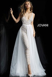 Jovani Bridal 60010 embellished v neckline jumpsuit with removable tulle overskirt  Available colors:  Nude/White, Nude/Black  Available sizes:  00-24   Details: Nude and white beaded prom jumpsuit with low v-neckline, sleeveless fitted bodice and low v-back, full length slim leg pants and detachable sheer tulle full length over-skirt. Pageant Wedding