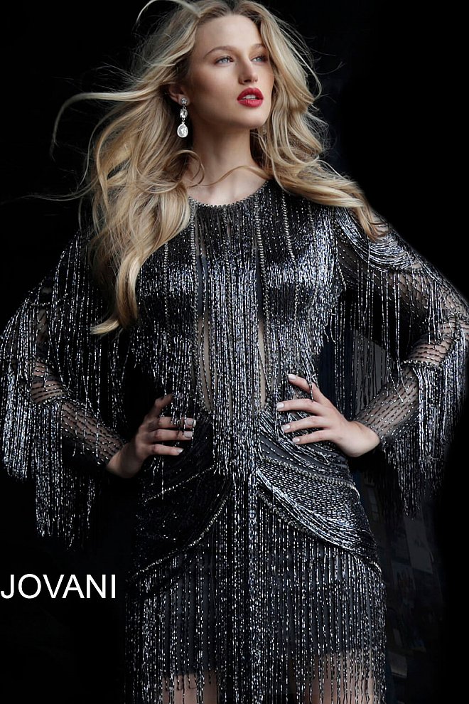 Jovani 61636 Gunmetal Fully Beaded Long Sleeve Fringe Short Cocktail Homecoming Dress. Make an unforgettable entrance in Jovani 61636. This gunmetal cocktail dress features long sleeves, fully beaded bodice, and fringe skirt with pockets. Perfect for a homecoming or special event, this breathtaking dress will have you turning heads.