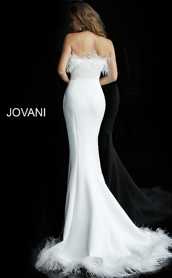 Jovani 63891 straight neckline with feather trim on the neckline and feather trim on the edge of the skirt with a sweeping train fitted mermaid evening gown wedding dress prom gown  Available colors:  Black, Navy, White  Available sizes:  00-24 