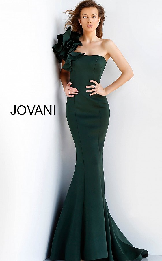 Jovani 63994 is a scuba mermaid Prom Dress, Pageant Gown & Formal Evening Wear gown.  Details: Dark green scuba mermaid evening dress with one shoulder ruffle detail bodice and straight neckline, princess seams and floor length fitted skirt with flared mermaid end and train.  Neckline:  Straight  Waistline: Natural Closure: Invisible back zipper Available Sizes: 00, 0, 2, 4, 6, 8, 10, 12, 14, 16, 18, 20, 22, 24  Available Colors: black, dark green, fuchsia, light-blue, navy, royal, tomato, white