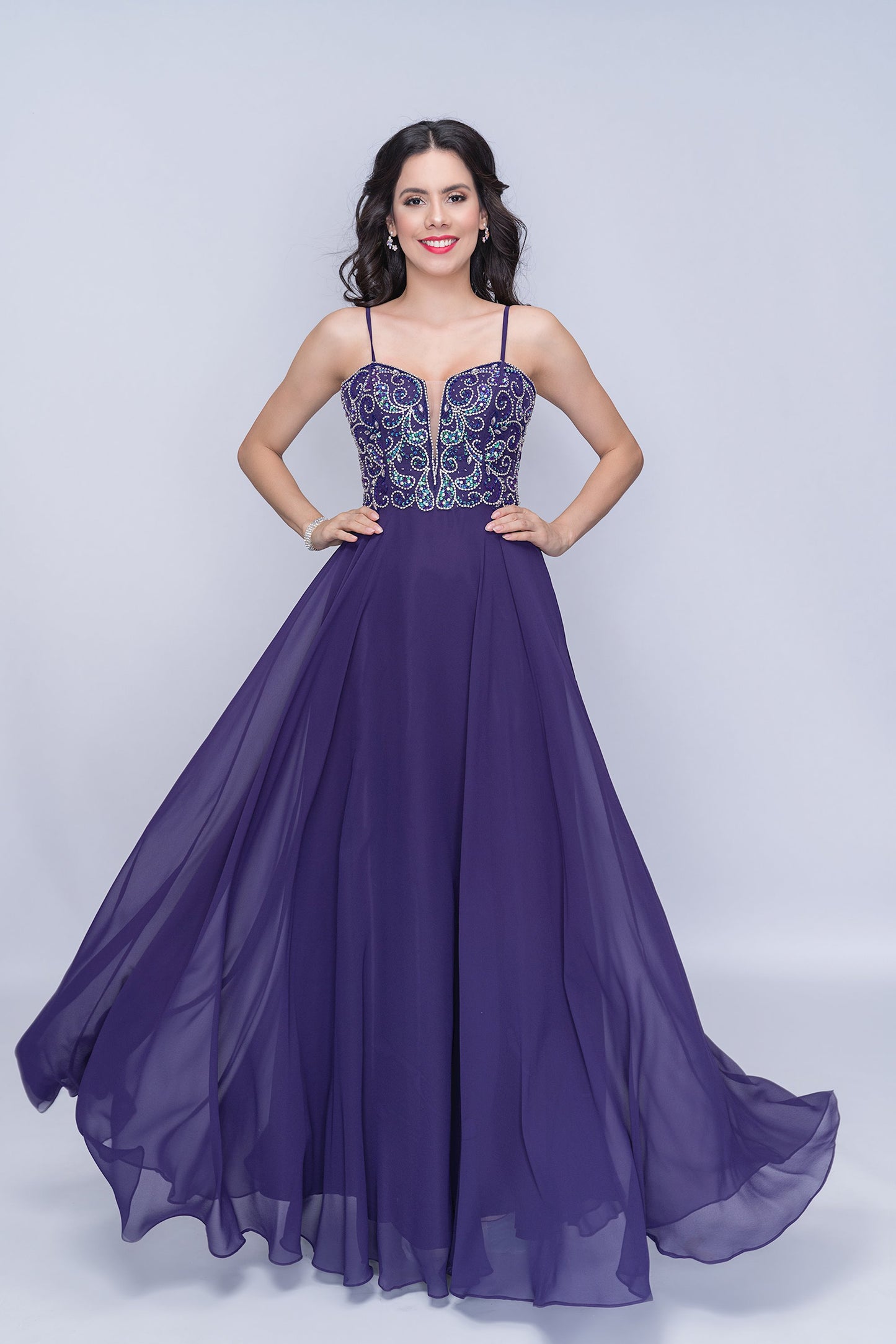 Nina Canacci 6509 Long flowing chiffon A Line Prom Dress. Featuring a Beaded &amp; Crystal Embellished Fitted bodice with a plunging neckline and spaghetti straps.&nbsp;

Available Sizes: 4, 6

Available Colors: Plum