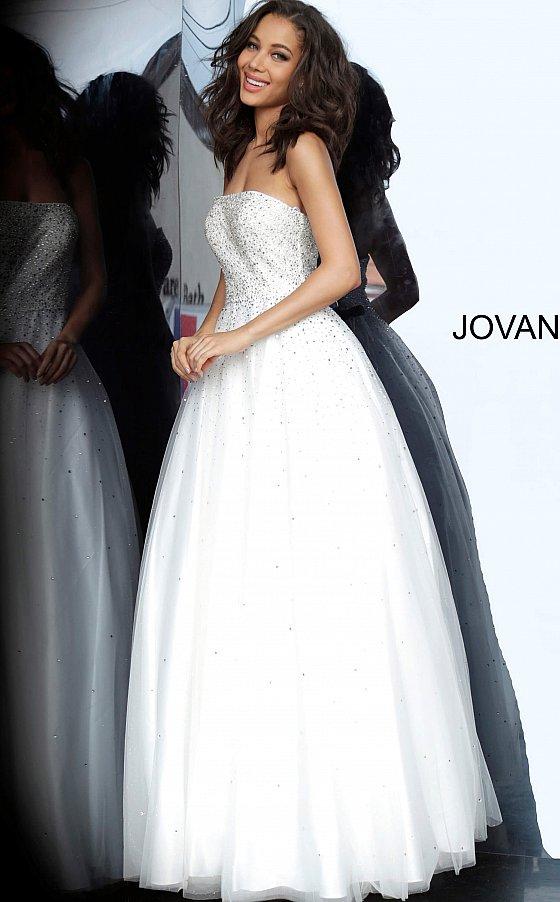 Jovani 65664 is a Prom Dress, Pageant Gown & simple wedding dress. Embellished tulle ballgown, fully lined, full floor length skirt, strapless bodice, straight neckline, lace up back. Available Sizes: 00-24  Available Colors: light-blue, light-pink, off-white