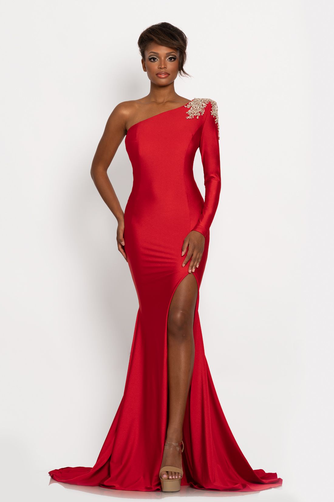 Johnathan Kayne 2224 One long sleeve fitted prom dress with embellishments on the shoulder.  This fitted long pageant gown has a high slit.  Colors  Black, Hot Pink,  Royal, Red  Sizes  00, 0, 2, 4, 6, 8, 10, 12, 14, 16, 18, 20, 22, 24