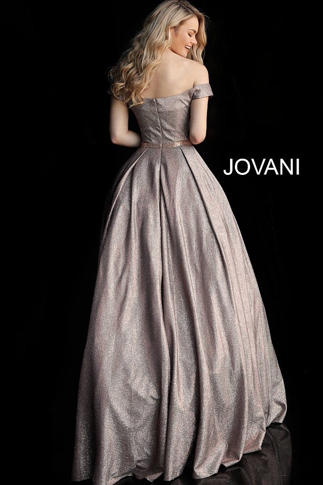 Jovani 66950  glitter prom dress ballgown with the off-the-shoulder sleeveless bodice, straight neckline, and beaded waist belt, floor-length pleated A-line skirt with side pockets. Makes a great evening ballgown. 
