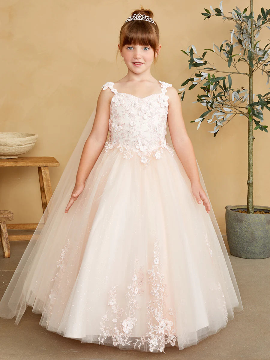 The Tip Top 7040 Long Glitter Lace Girls Pageant Dress is an elegant choice for any special occasion. Crafted from high-quality glitter lace fabric, this dress features a detachable cape with floral appliques. The perfect dress for flower girls and pageant hopefuls.   Floral lace bodice with 3D flowers Floor length glitter tulle skirt with floral applique 3D flowers on the straps Has a detachable cape