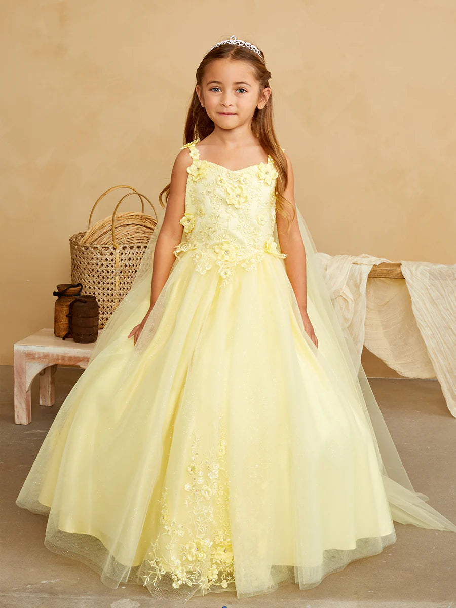 The Tip Top 7040 Long Glitter Lace Girls Pageant Dress is an elegant choice for any special occasion. Crafted from high-quality glitter lace fabric, this dress features a detachable cape with floral appliques. The perfect dress for flower girls and pageant hopefuls.   Floral lace bodice with 3D flowers Floor length glitter tulle skirt with floral applique 3D flowers on the straps Has a detachable cape