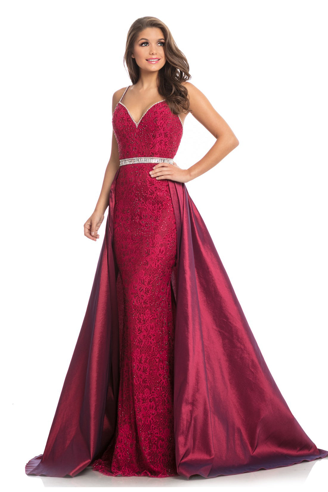 Johnathan Kayne 7242 is a lace Prom Dress, Pageant Gown & Formal Evening Wear. The structured bodice of this A/B crystal adorned stretch lace gown offers excellent, supportive construction. The column skirt falls over the hip and is framed by the dramatic taffeta hostess skirt that flows around the body.