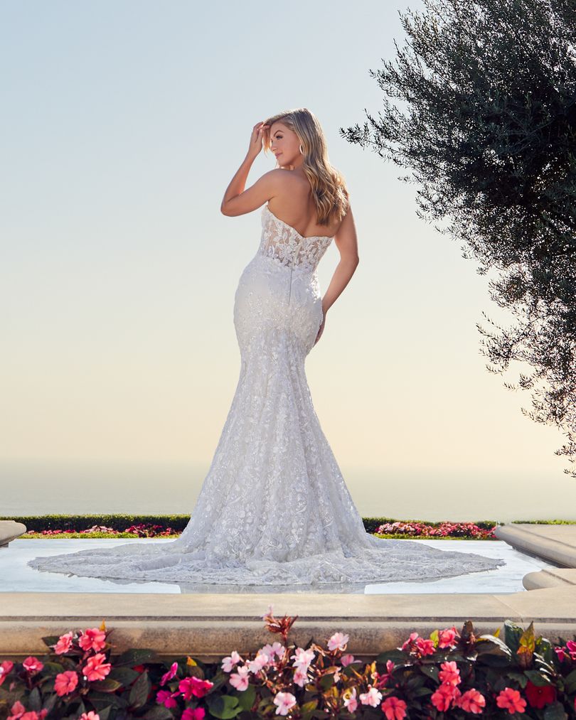 Casablanca 2448 Joceyln   Beading and lace will never go out of fashion, and Style 2448 is the perfect example of timeless beauty. This glamorous wedding dress features layers upon layers of detail, with perfecting satin, organza, and Chantilly lace sitting underneath sparkling beaded floral lace. A fit and flare silhouette accentuates the natural curves of the body, held up by a supportive strapless sweetheart neckline. A beautiful 74 inch train is the final touch for this modern wedding day look.