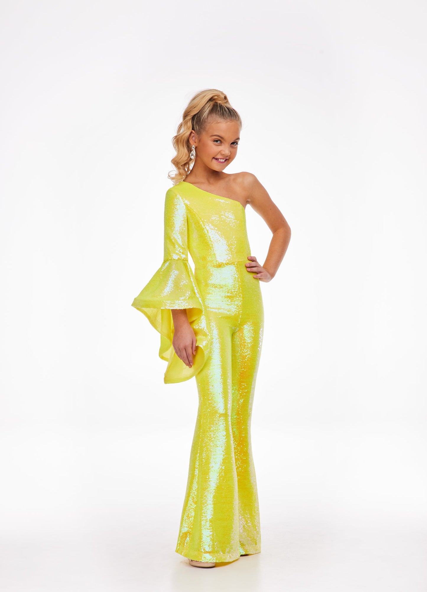 Ashley Lauren Kids 8110 One Shoulder Jumpsuit Long Bell Sleeve Sequin Pageant This groovy one shoulder jumpsuit features an oversized bell sleeve and flared pants. One Sleeve Oversized Bell Sleeve Sequin Fabric Jumpsuit Available Sizes: 2-16 Available Colors: Coral, Lilac, Yellow, Neon Green