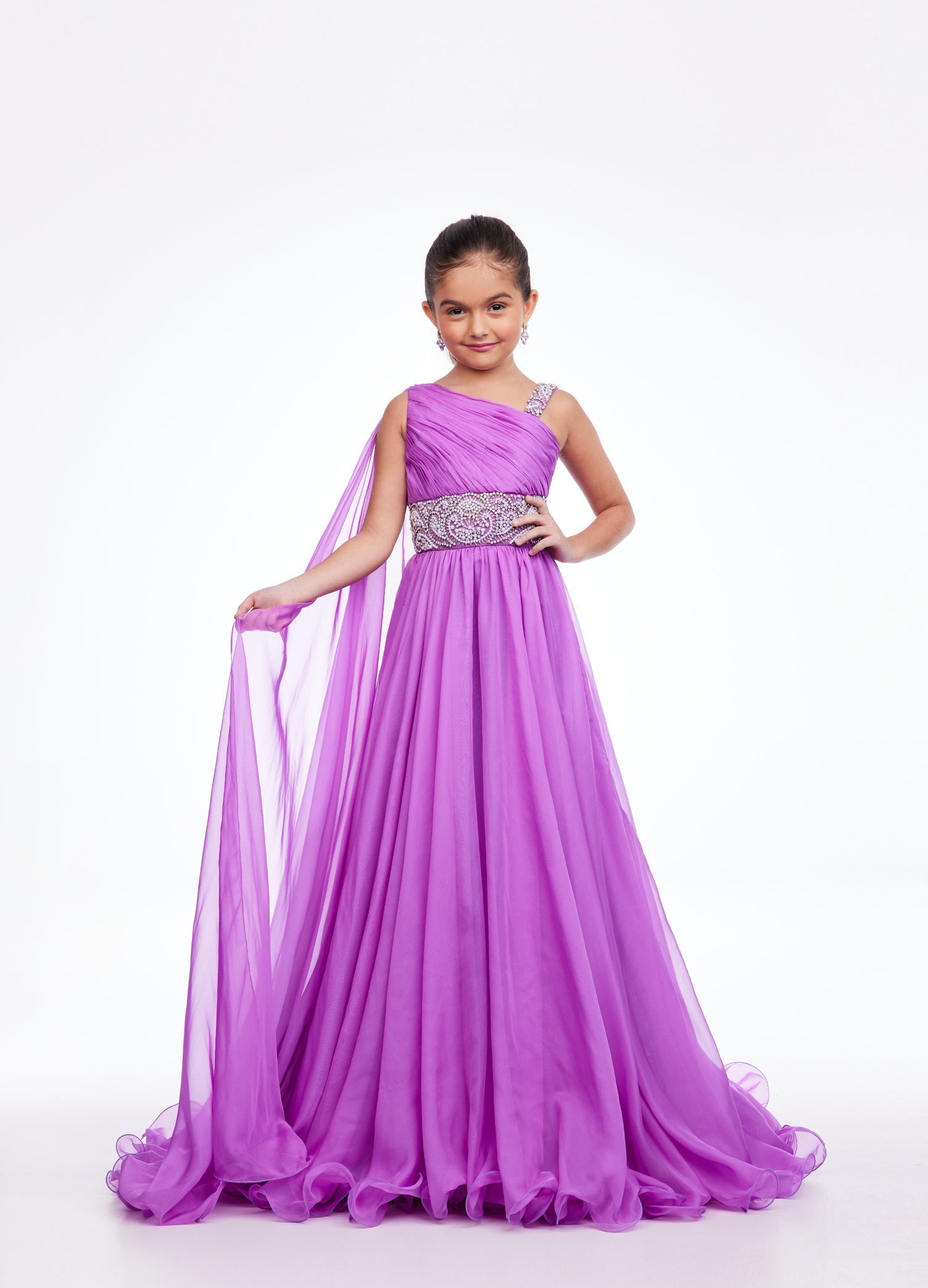 Ashley Lauren Kids 8122  Girls and Preteens Pageant Dress.  This Grecian inspired one shoulder chiffon gown features an ornately beaded waist giving way to an A-Line chiffon skirt. The look is complete with an attached shoulder chiffon cape.  Available colors:  Orchid, Aqua, Ivory
