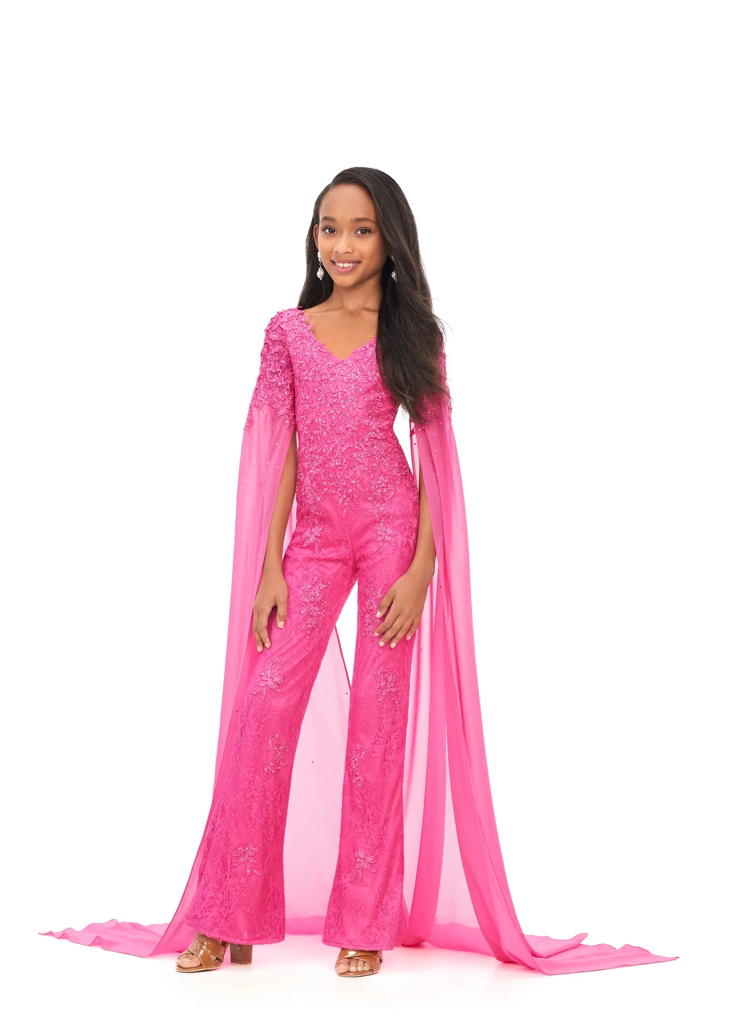 Ashley Lauren Kids 8162 Lace Girls Cape Sleeve Jumpsuit Formal Fun Fashion V Neck Chiffon This jumpsuit is bringing all the drama. It features a v-neckline, lace embroidery and dramatic cape sleeves perfect for your next fun fashion or runway. V-Neckline Embroidery Cape Sleeves Jumpsuit