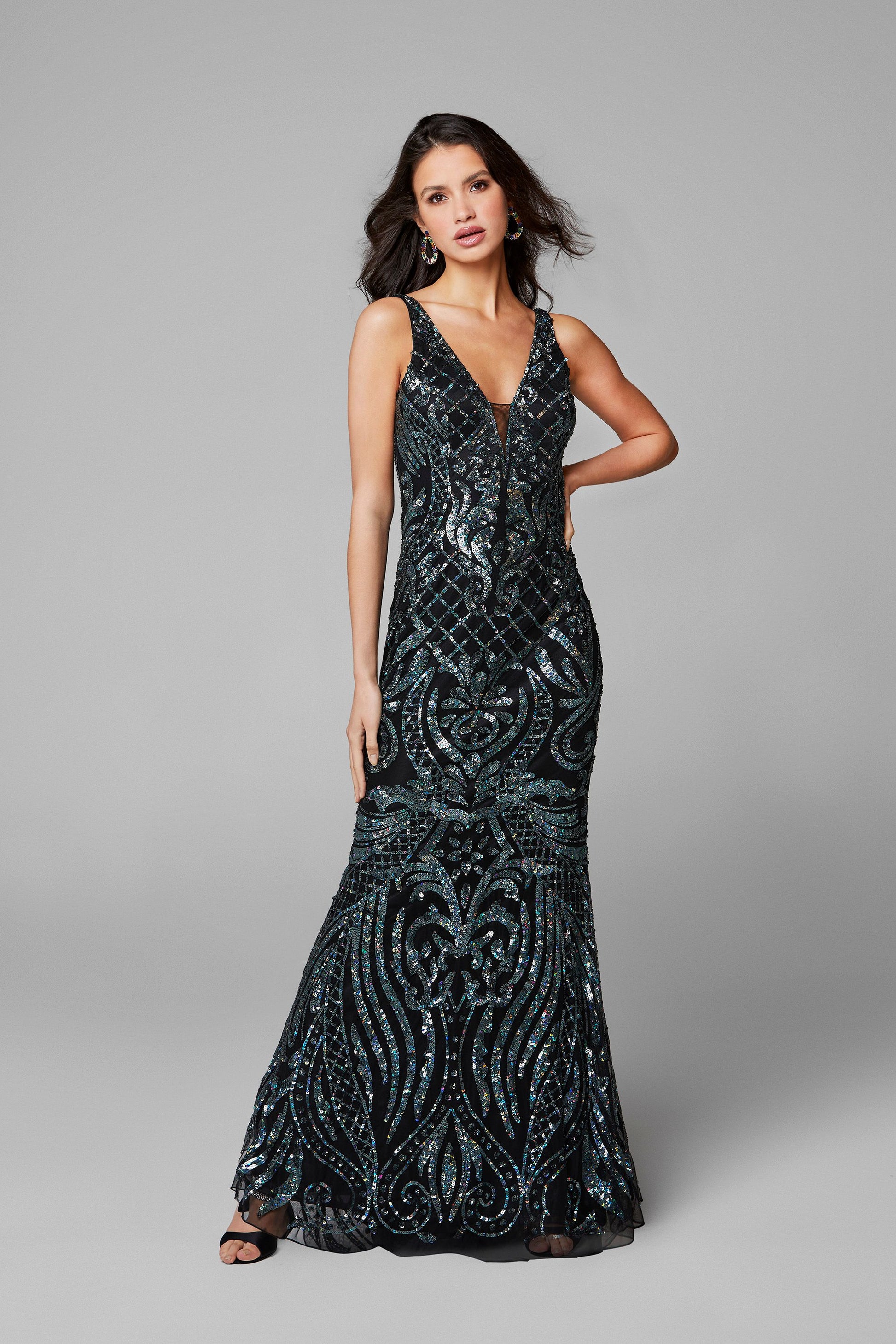 Primavera Couture 3612 is a long Fitted Sequin Embellished Formal Evening Gown. Featuring a Plunging Deep V Neckline. Elegant Sequin Embellishments scroll down throughout the length of this fit & Flare Prom Dress.  Available Sizes: 00,0,2,4,6,8,10,12,14,16,18  Available Colors: Black/Blue, Black/Multi, Ivory, Yellow