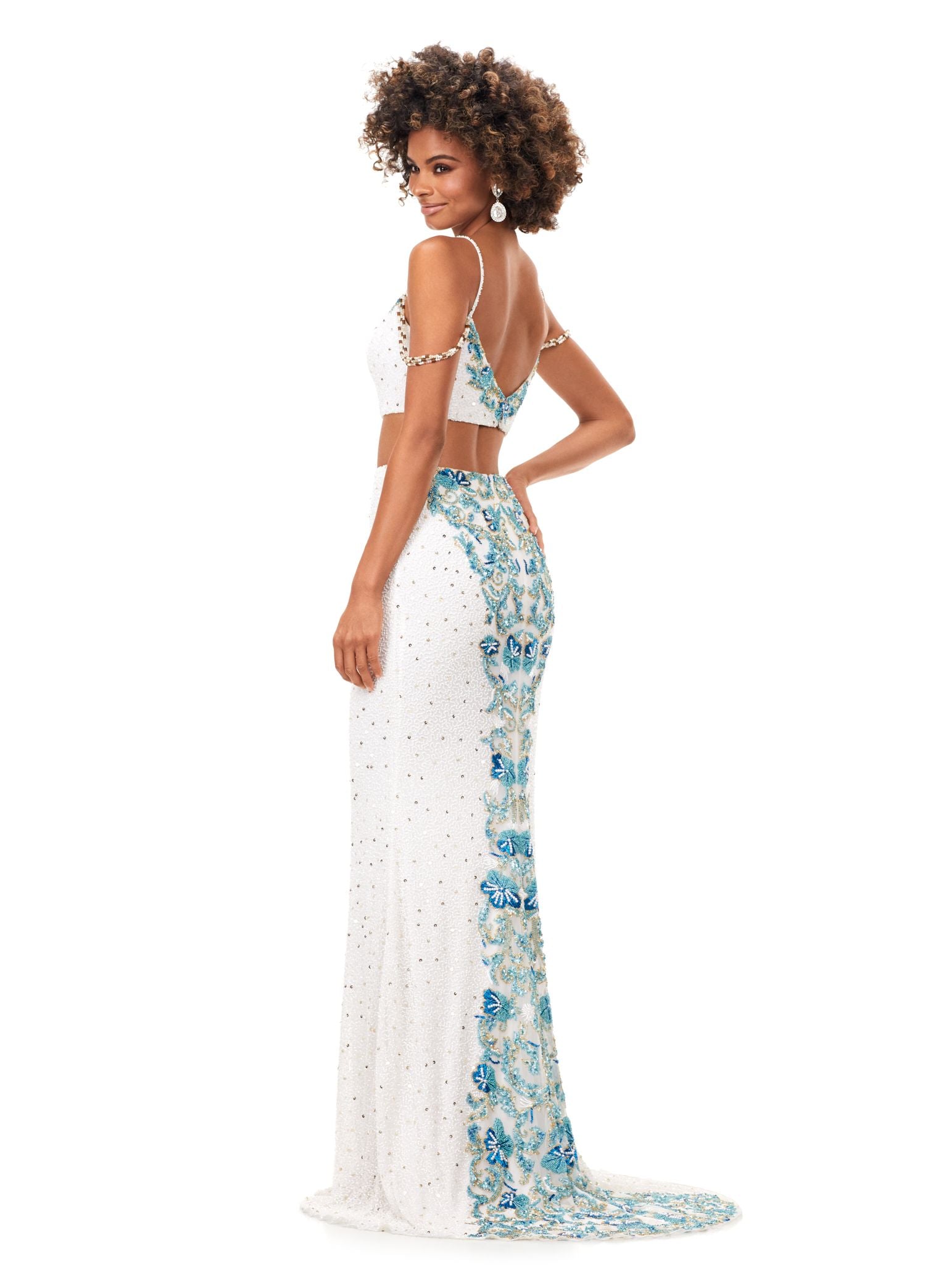 Ashley Lauren 11353 This spaghetti strap beaded gown features an intricately beaded bustline accented by shoulder draped straps. The intricate bead pattern continues onto the back and is finished with a sweep train. Sweetheart Neckline Spaghetti Straps Two-Piece Fully Hand Beaded COLORS: Periwinkle, Ivory, Black
