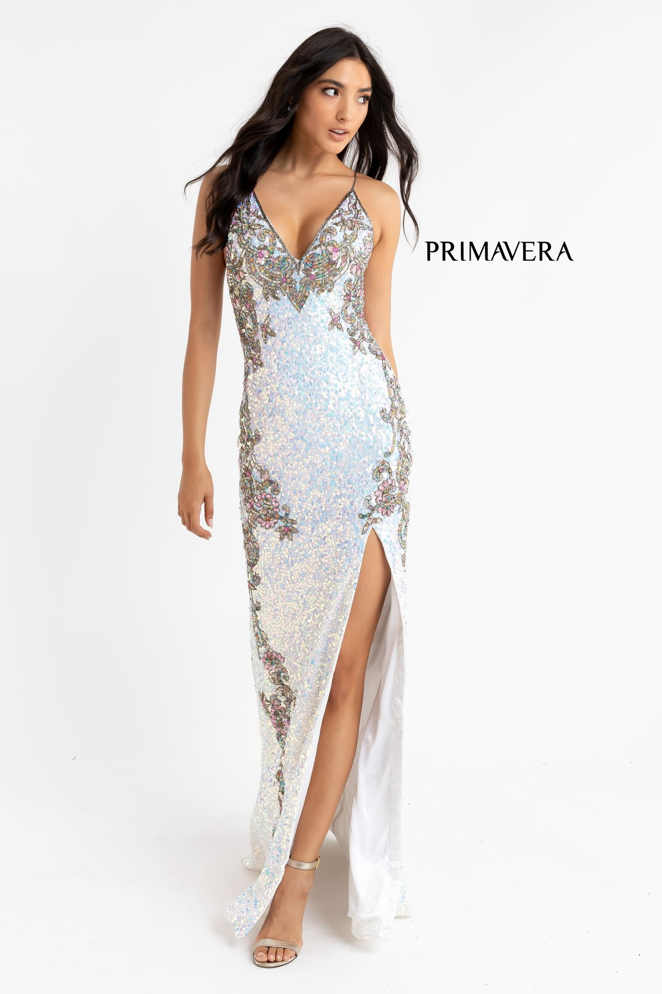 Primavera Couture 3211 Ivory  is a Long fitted sequin Embellished Formal Evening Gown. This Prom Dress Features a deep V Neck with an open Corset lace up back. Beaded & embellished elegant scroll pattern accentuate curves. Fully beaded prom dress with floral pattern and side slit. Long Sequin Gown featuring a v neckline. slit in the fitted skirt, Slit in Thigh. Stunning Pageant Dress, Prom Gown & More!
