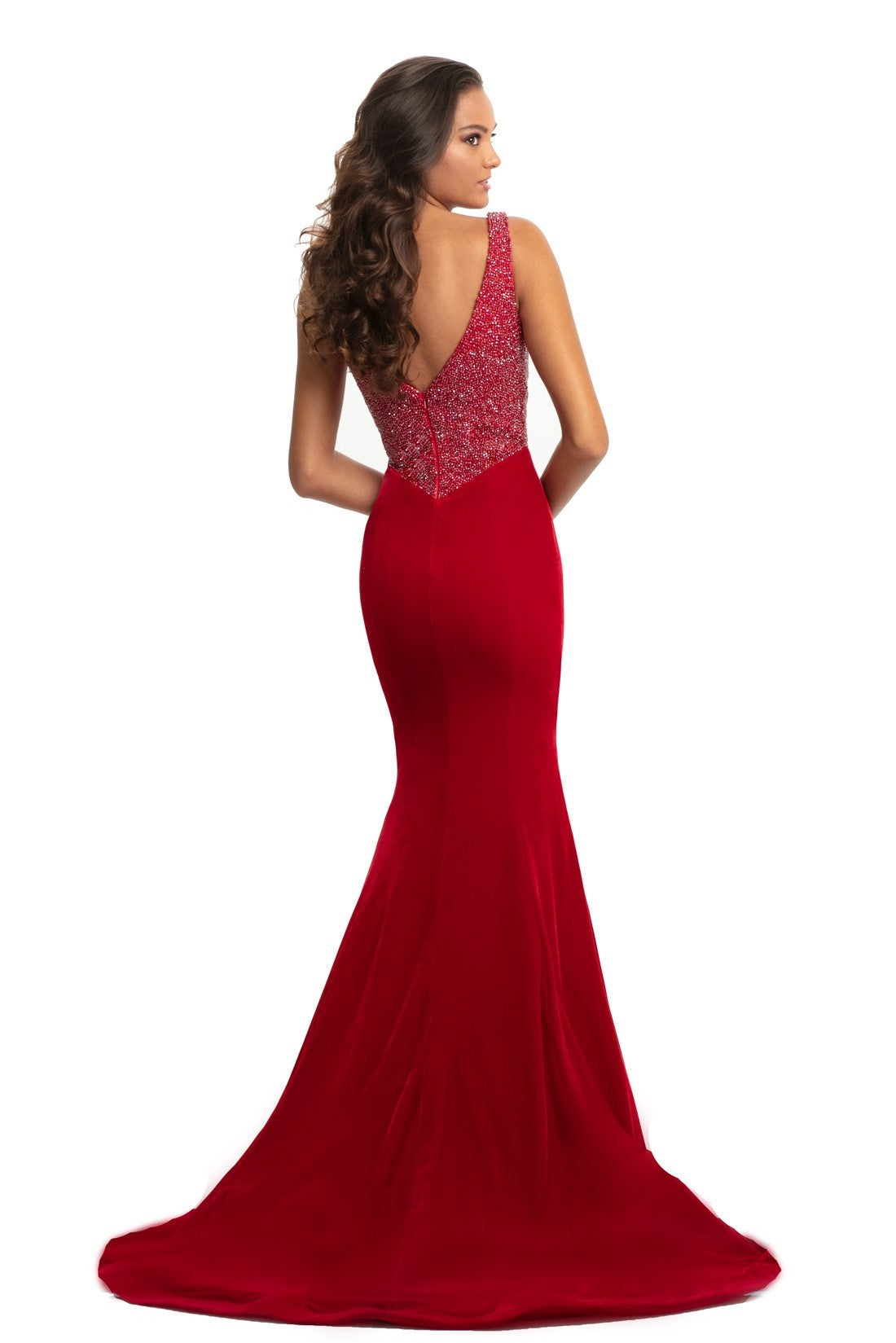 Johnathan Kayne 9019 is a velvet mermaid Prom Dress Pageant Gown & Formal Evening Wear. Long fitted mermaid silhouette with a basque waistline. Fully Embellished bodice is covered in crystal studs and beading. Plunging neckline with mesh insert.