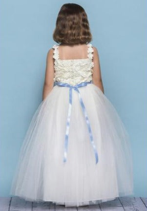 Rosebud Fashions Style 5131 is a full length dress with a full tulle skirt. The bodice has spaghetti straps with a square neckline and back covered with a 3D flower lace Appliques. The waist is accented with a ribbon that ties in the back. Satin buttons cover the zipper. Flower Girl Dress Tulle ballgown skirt.  Available Sizes: 2,4,6,8,10,12  Available Colors: White, Ivory  Fabric is Satin,  Lace, and Tulle