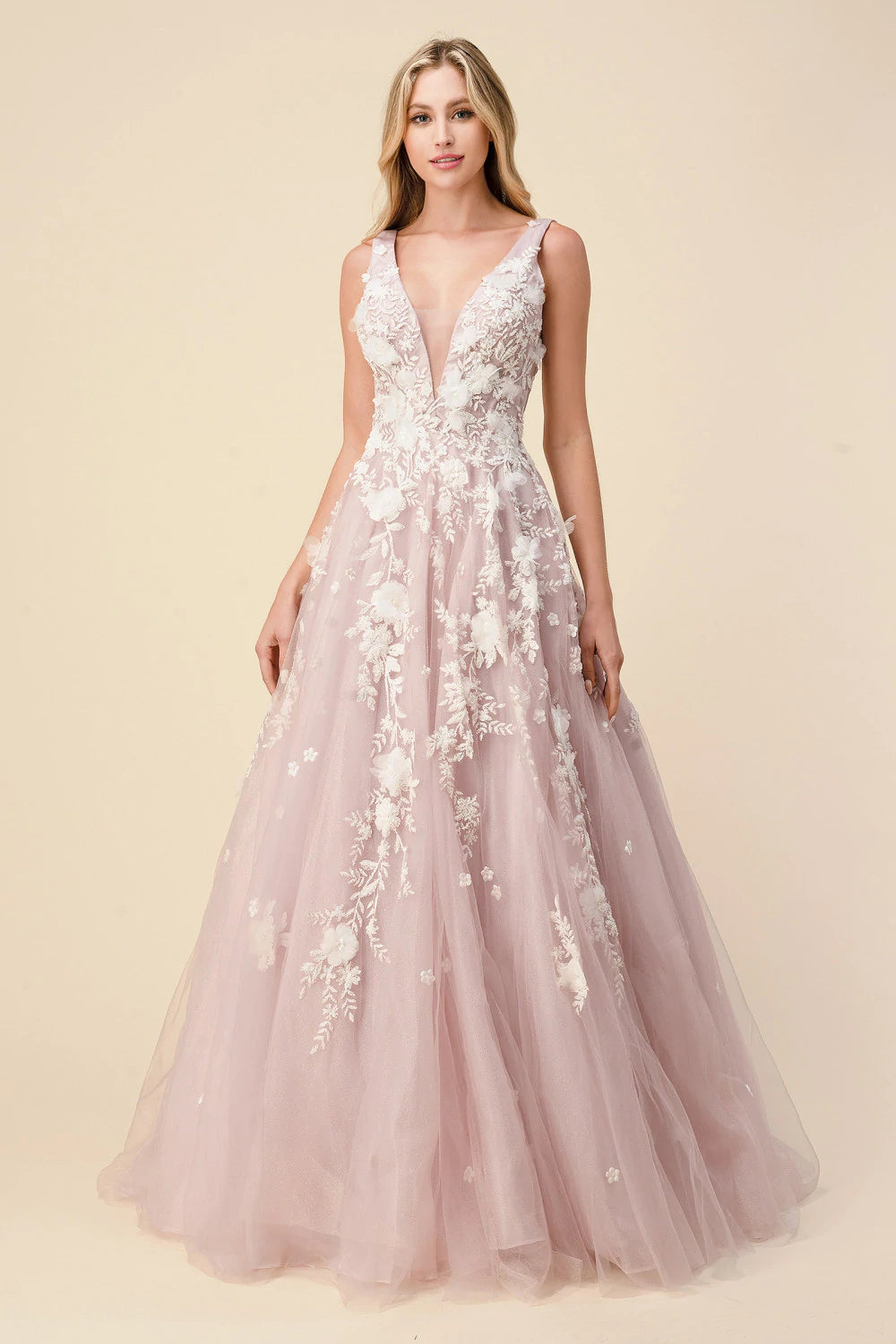 Andrea & Leo Gardenia A1028 Long Shimmer Ball Gown 3D Lace Formal Dress V Neck Gardenia gown is a layered tulle ball gown with floral diamond glitter motif trickling down the gown. 3D organza flowers add couture depth to the garment, while the pastel tone of the dress provides soft backdrop to the floral shimmer. The bodice features a illusion V-neckline with sheer side with deep V-back. The skirt is A-line shape with crinoline to support the silhouette.