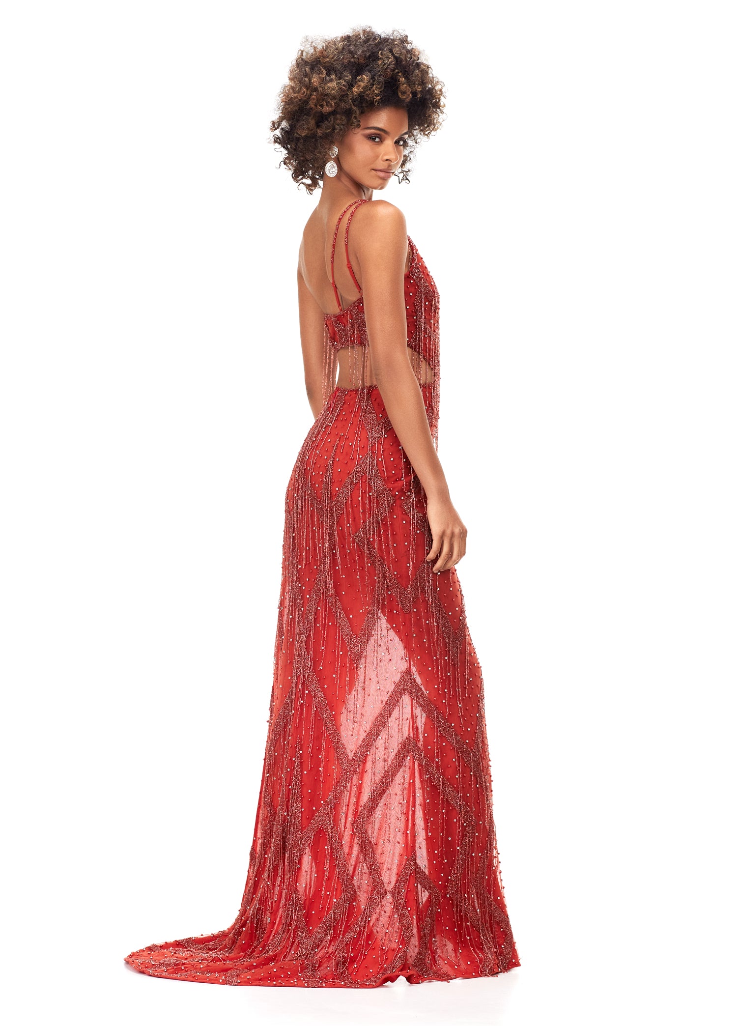 Ashley Lauren 11280 This daringly different one shoulder beaded gown features an intricate bead pattern with scattered fringe throughout. The look is complete with side cut outs and a side left leg slit. One Shoulder Cut Outs Fringe Accents Fully Beaded COLORS: Turquoise, Orange, Black