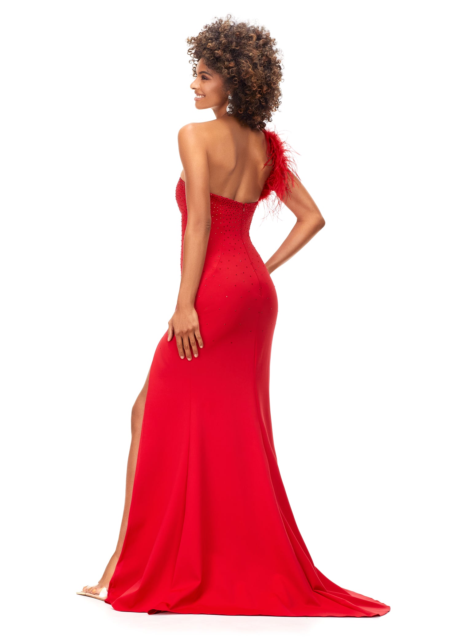 Ashley Lauren 11290 Red One Shoulder Prom Dress crystal top one shoulder with feathers Stand out in this one shoulder scuba gown. The neckline is embellished with feathers to provide a fun and flirty detail. The bodice is accented by heat set stones that cascade down on the skirt. The look is complete with a left leg slit.