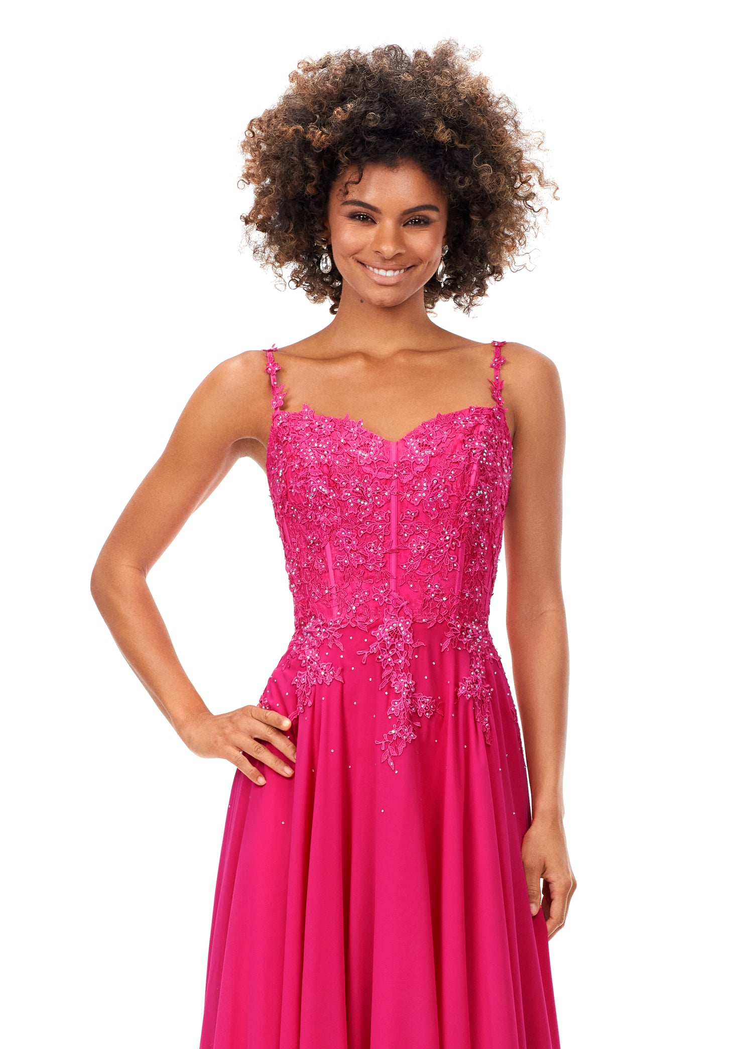 Ashley Lauren 11332 This classic chiffon prom, pageant and evening dress features a sweetheart neckline with spaghetti straps. The bustier on this dress is a corset style with lace appliques throughout. The lace appliques carry down onto the a-line skirt.
