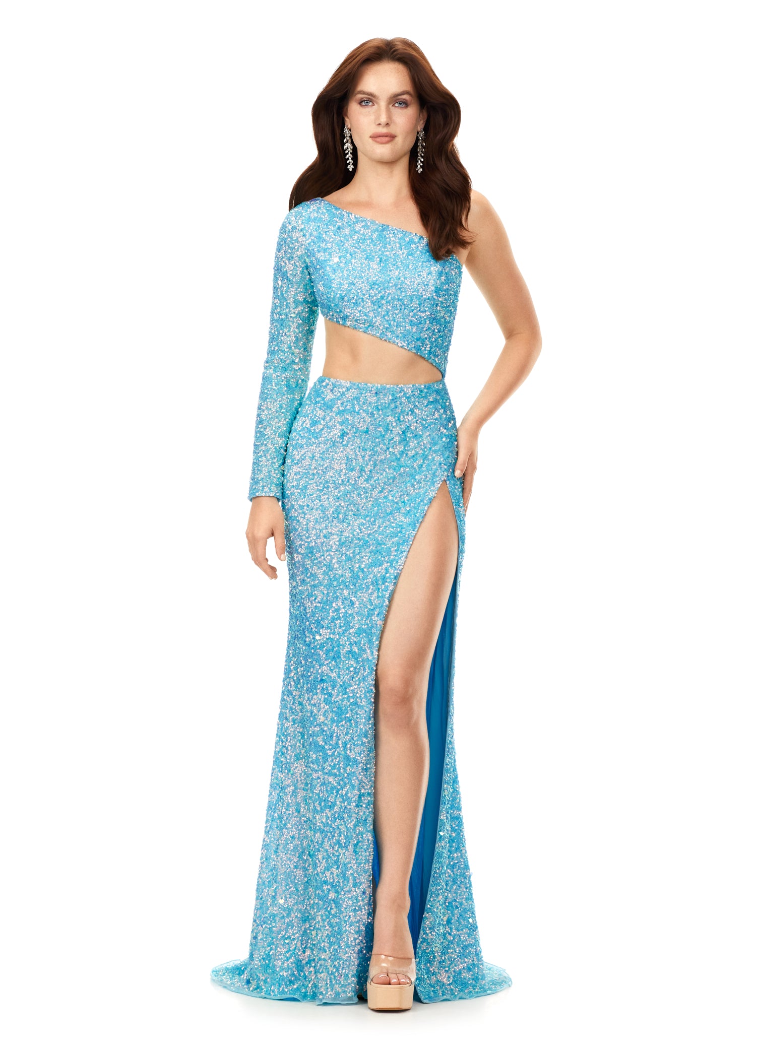 Ashley Lauren 11340 This sequin one shoulder gown features one sleeve and a shark bite cut out. The gown is complete with a left leg slit.