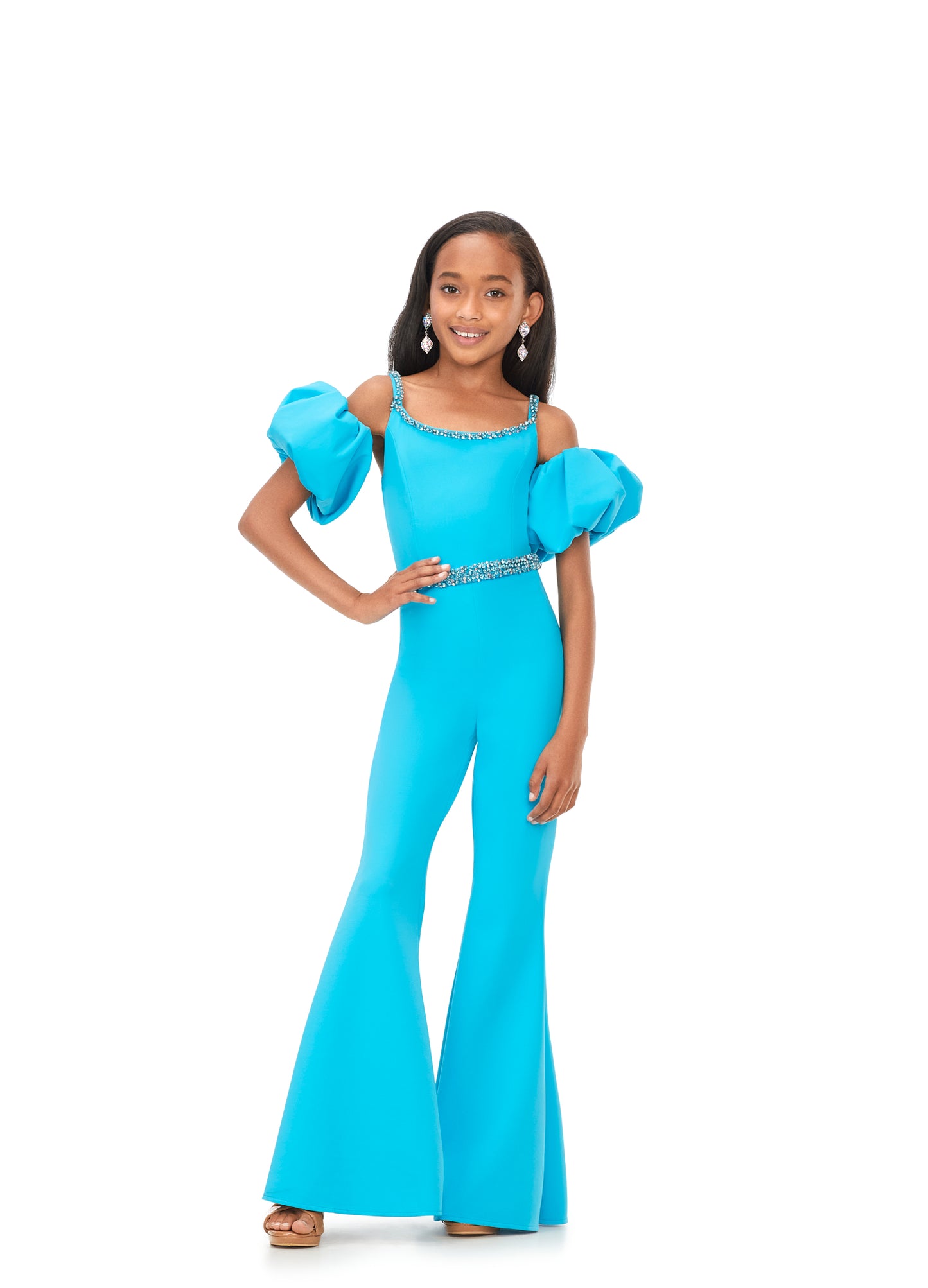 Ashley Lauren Kids 8164 Girls Off Shoulder Scuba Jumpsuit with Puff Sleeves  A scuba jumpsuit with off shoulder puff sleeves? We're obsessed! This jumpsuit has a beaded neckline and waist band to offer the right mix of classy and fabulous.