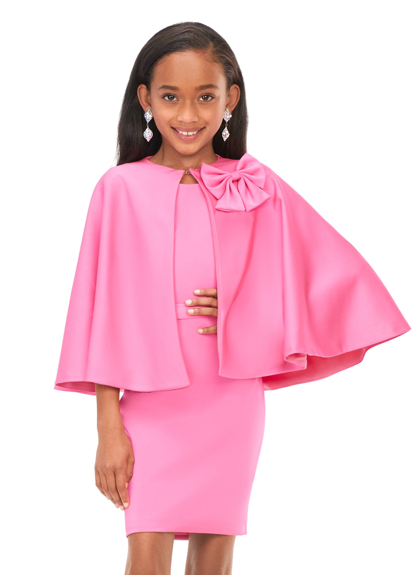 Ashley Lauren Kids 8166 Girls Cocktail Dress with Cape Bow  Two looks in one! This dress features a detachable, bow-adorned cape. Underneath the cape is a simple and stunning crepe dress perfect for your next event.