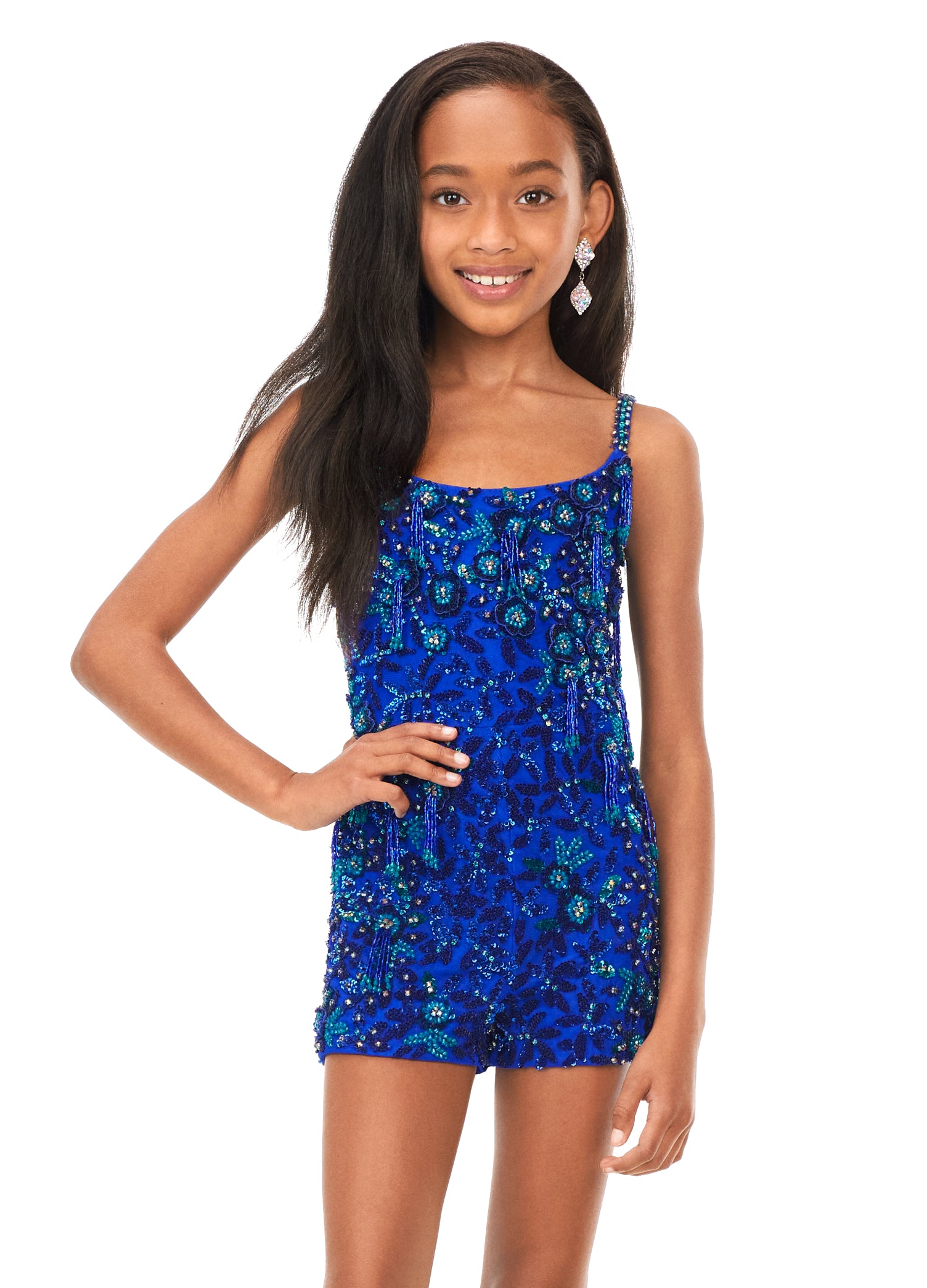 Ashley Lauren Kids 8186 Girls Beaded Romper with Fringe  This kids romper features a scoop neckline with spaghetti straps. The beaded romper is embellished with scattered 3-dimensional beaded appliques with fringe throughout.