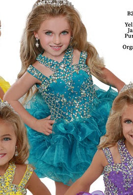 Ritzee Girls B279 is a short Layered ruffle cupcake Pageant Dress. Featuring a multi strap high neckline with AB Crystal Rhinestone Embellishments along the Top & Bodice. Open Cutout embellished back. Stunning stage gown!  Available Sizes:  2  Available Colors: Jade