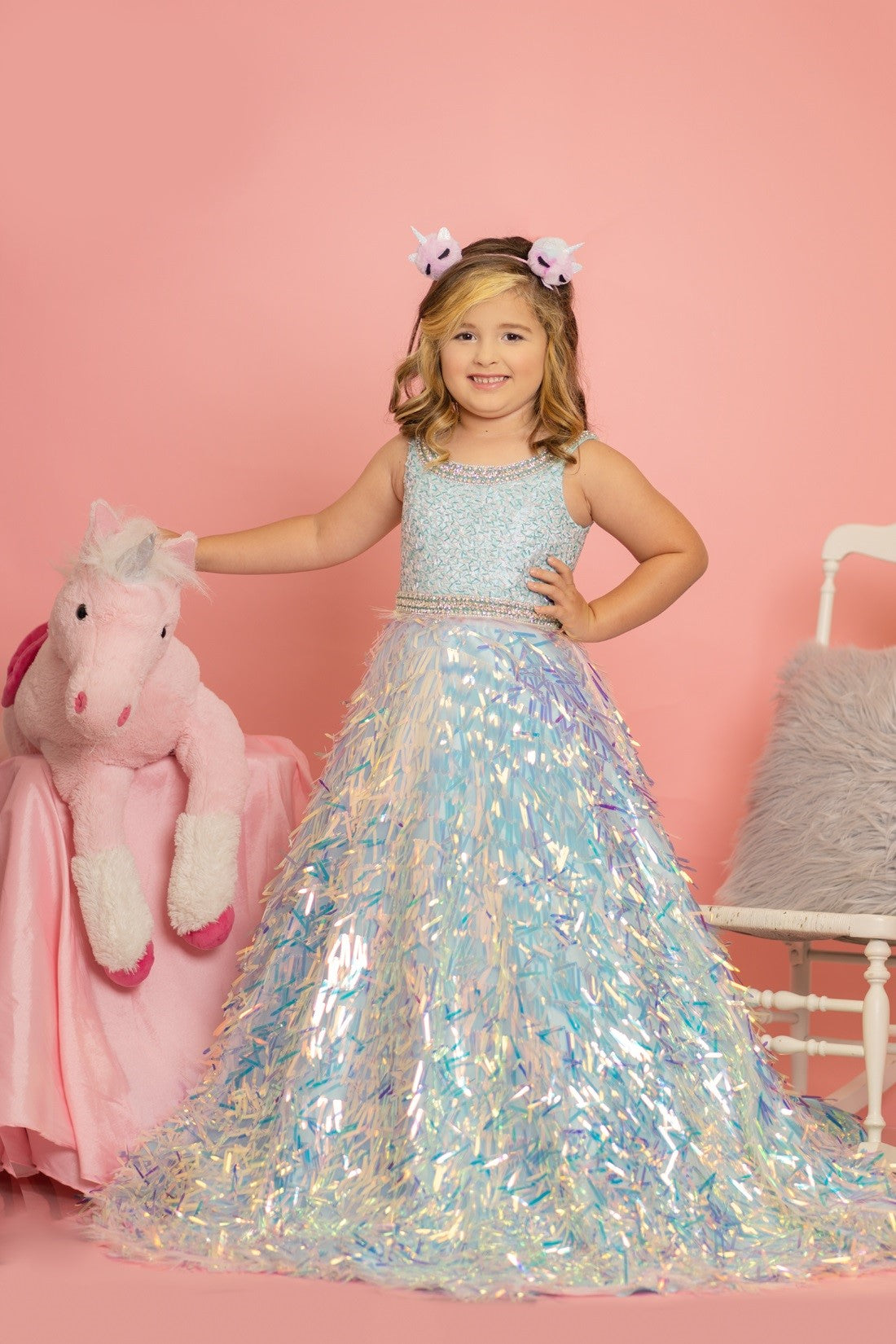 Sugar Kayne C100 by Johnathan Kayne is a Girls & Preteens long Pageant A Line Ballgown with a sequin fringe skirt. Scoop neckline with crystal embellished edges around top & waistline.   Available Colors: White, Blue/Multi, Pink/Multi  Available Size: 2-16