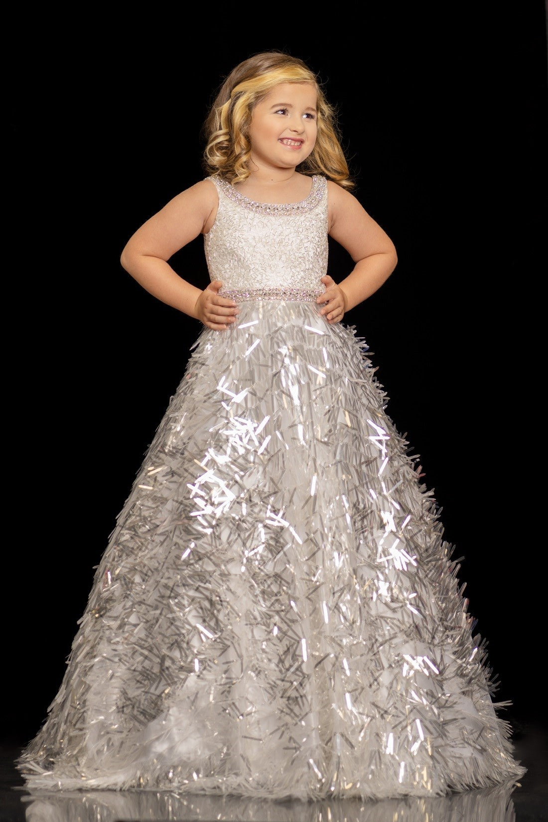 Sugar Kayne C100 by Johnathan Kayne is a Girls & Preteens long Pageant A Line Ballgown with a sequin fringe skirt. Scoop neckline with crystal embellished edges around top & waistline.   Available Colors: White, Blue/Multi, Pink/Multi  Available Size: 2-16