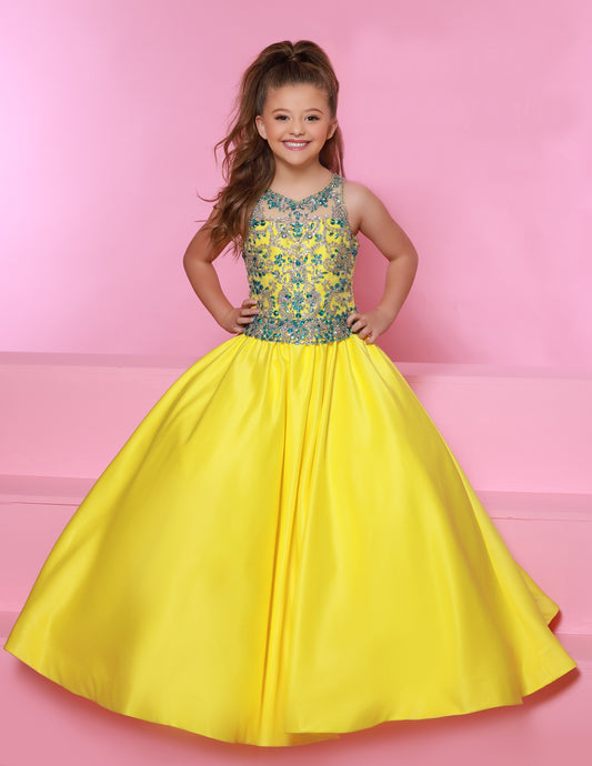 Sugar Kayne C158 Is a long sating A Line Ballgown girls Pageant Dress. Featuring a fully embellished bodice with a sheer illusion high neckline.  Colors: Lemon/Aqua, White/Aqua  Sizes:  2-16  (Sizes 2-6 do not have bust cups, Sizes 8-16 will have preteen size bust cups)