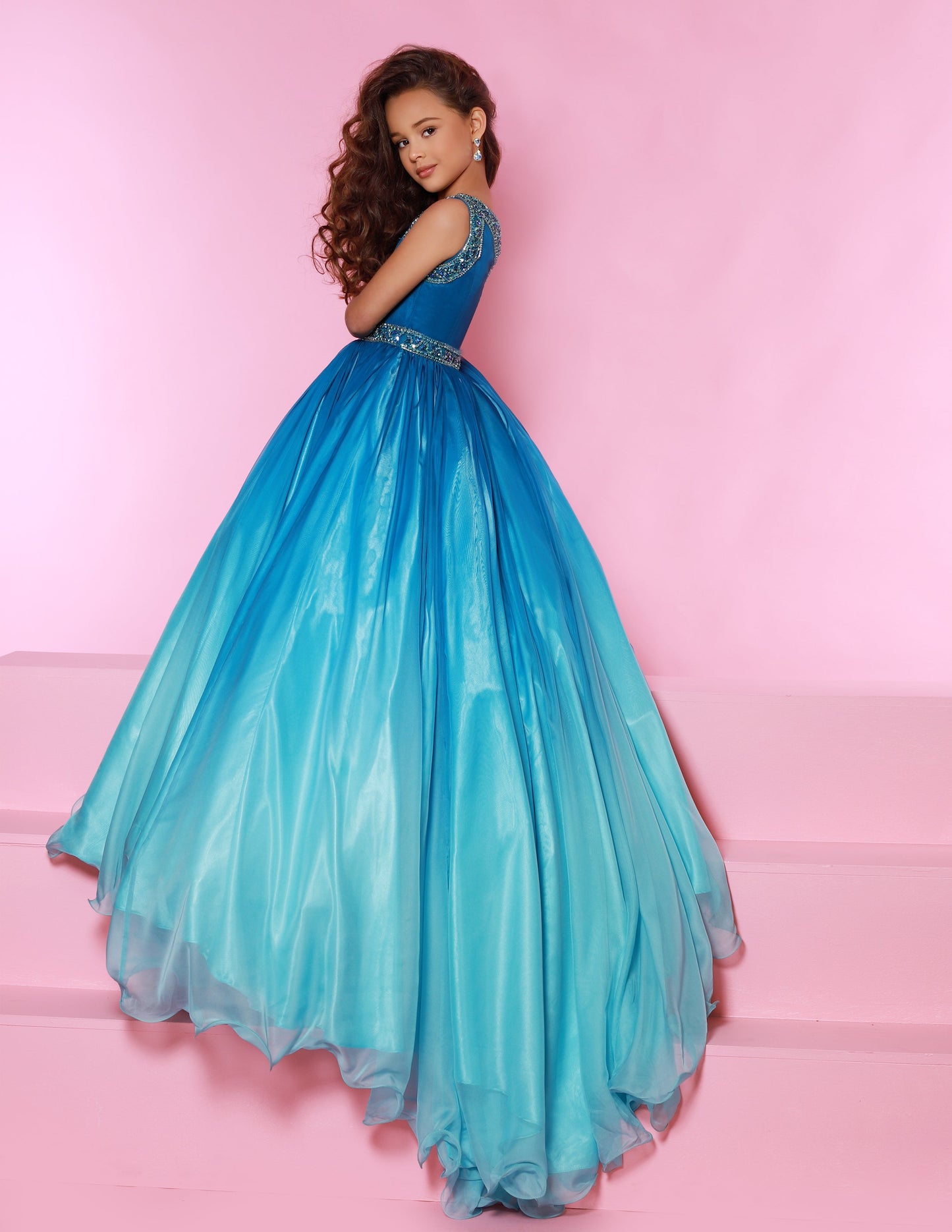 Sugar Kayne C169 is a long Ombre Girls Pageant Dress. Featuring an embellished one shoulder design. Colors: Cherry/Ombre, Blueberry/Ombre  Sizes:  2-16  (Sizes 2-6 do not have bust cups, Sizes 8-16 will have preteen size bust cups)
