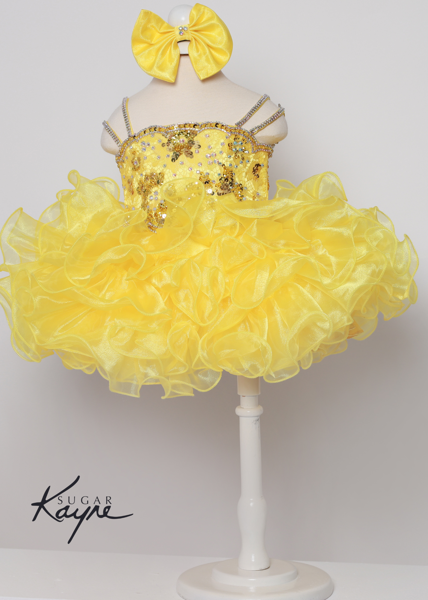 Sugar Kayne C225 Girls Baby Lace Sequin Crystal Cupcake Pageant Dress Ruffle Skirt Bow Corset.. Have your little cupcake bring on all the charm in this stunning organza and stretch lace gown. The corset back is the perfect addition as the little one grows!  Colors: Barbie Pink, Royal, Yellow, White  Sizes: 0M, 12M, 18M, 24M, 2T, 3T, 4T, 5T, 6M, 6T  Fabric Organza, Stretch Lace, Satin Lining