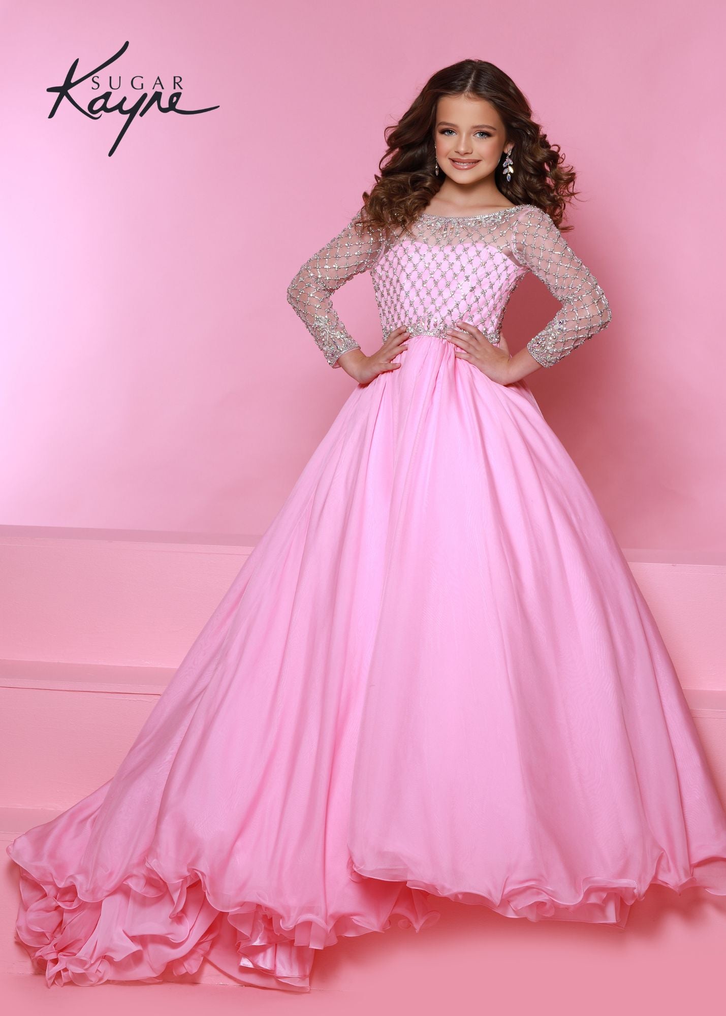 Sugar Kayne C303 Long Sleeve Sheer Crystal Chiffon Girls Pageant Dress Ball Gown Dress Product Details Be the princess you were born to be! This chiffon ballgown spotlights the luxurious hand-beaded bodice with long-sleeves to make an exquisite entrance.  Colors: Baby Blue, Petal Pink, White  Sizes: 2, 4, 6, 8, 10, 12, 14, 16  Fabric Chiffon, Mesh, Satin Lining