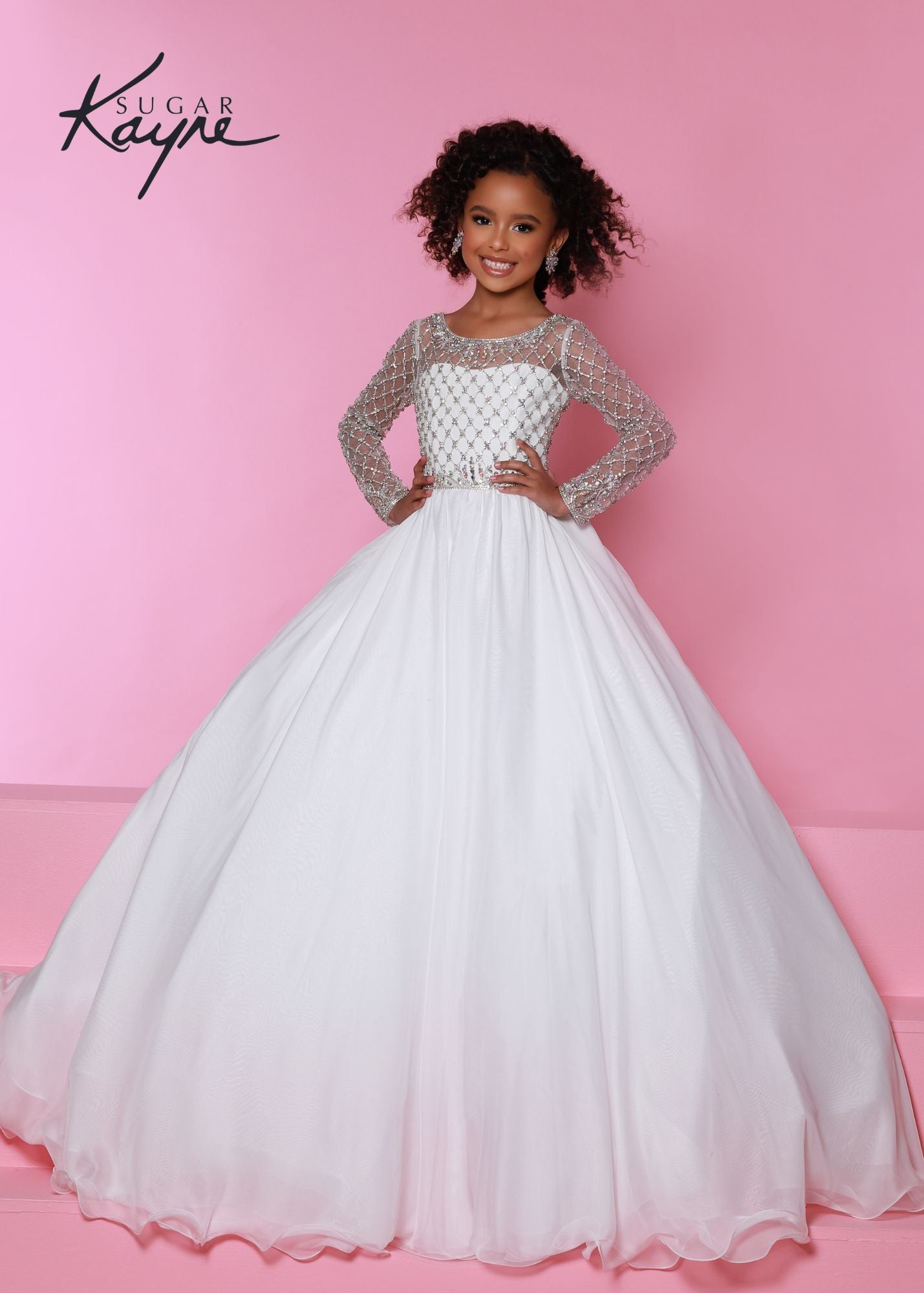 Sugar Kayne C303 Long Sleeve Sheer Crystal Chiffon Girls Pageant Dress Ball Gown Dress Product Details Be the princess you were born to be! This chiffon ballgown spotlights the luxurious hand-beaded bodice with long-sleeves to make an exquisite entrance.  Colors: Baby Blue, Petal Pink, White  Sizes: 2, 4, 6, 8, 10, 12, 14, 16  Fabric Chiffon, Mesh, Satin Lining