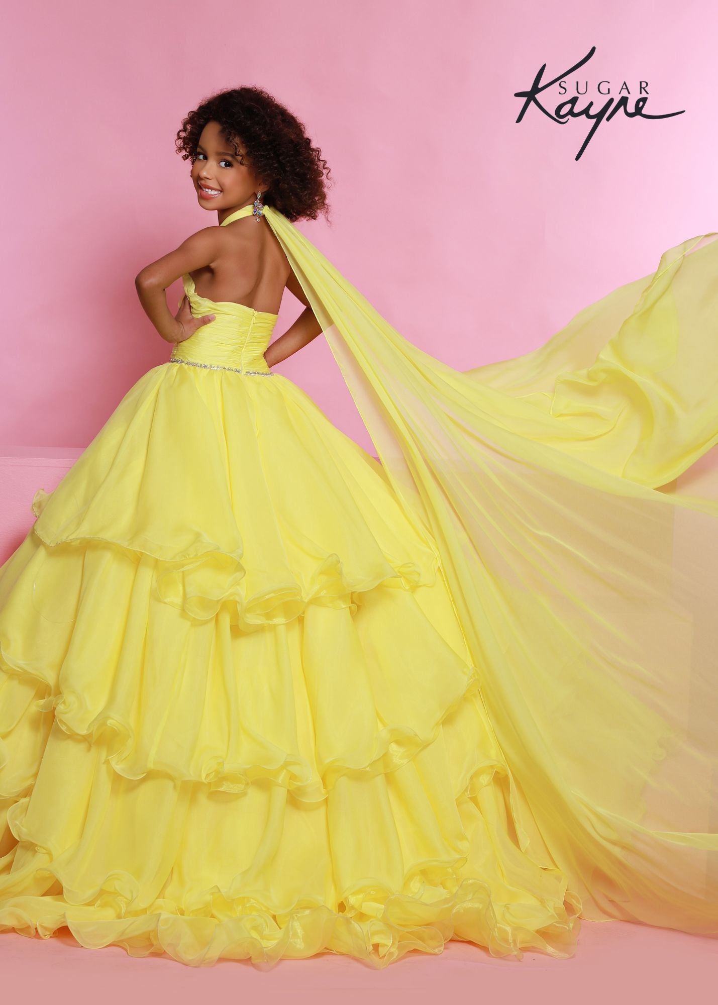 Sugar Kayne C305 Layer Girls Ruffle Pageant Ball Gown Cape Halter Formal Dress Oh s'cute!! This poly chiffon layered ballgown features a crisscross halter neckline with beaded trim along the waist. The train will float seamlessly across the stage, especially with the detachable cape.  Colors: Baby Blue, Lemon, White  Sizes: 2, 4, 6, 8, 10, 12, 14, 16  Fabric Poly Chiffon, Satin Lining